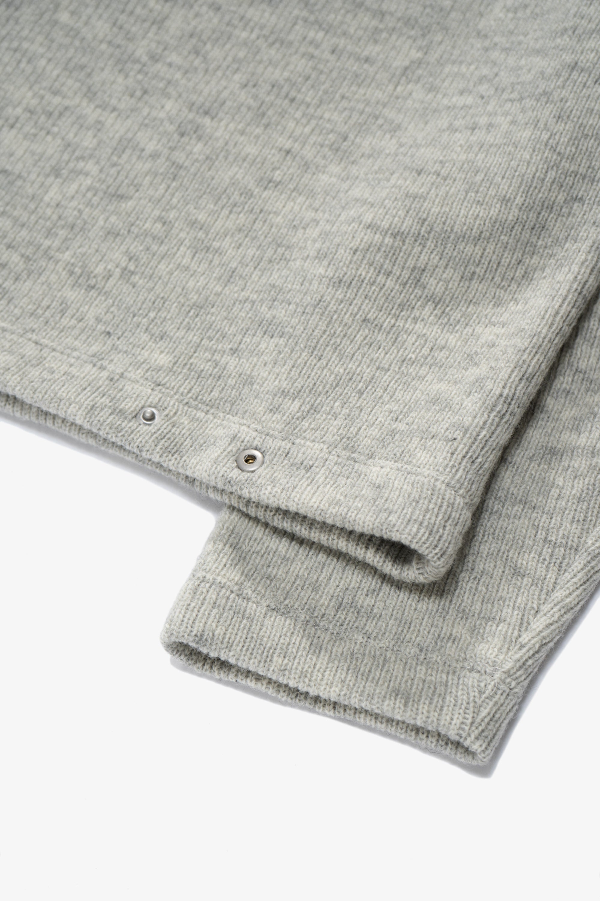 Close-up of rear waist of LW770CW V Neck Snap Sweater, showing snaps