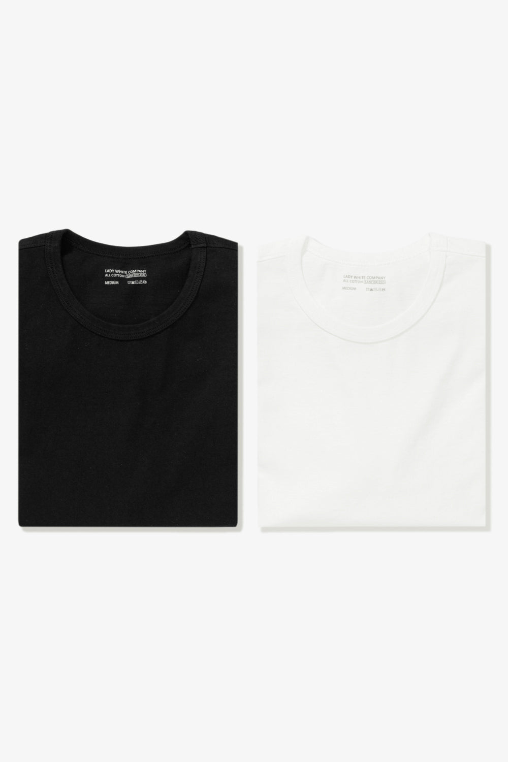 Two LW101 Our T-shirts, one white, one black, side by side