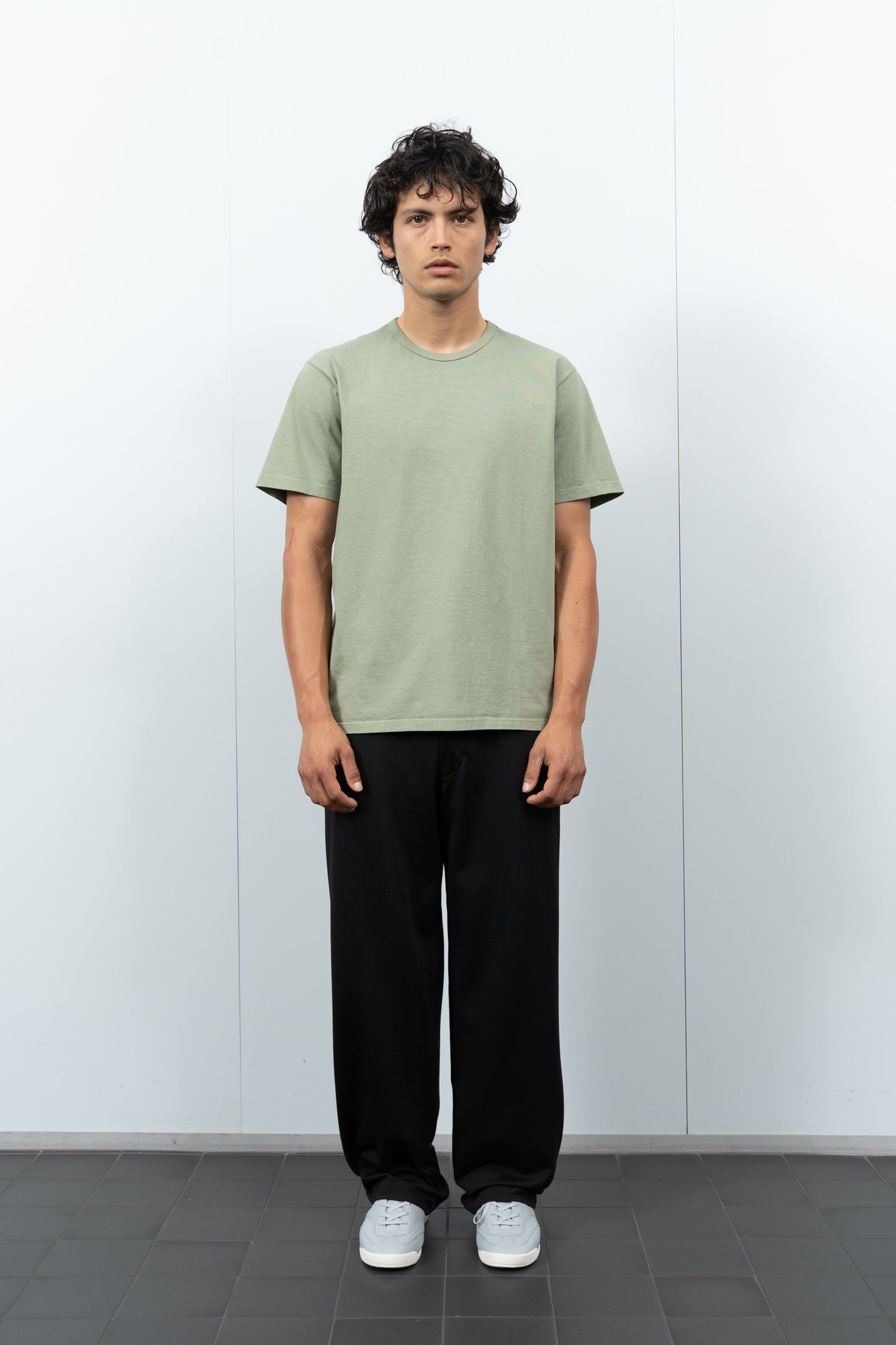 Front-facing on-model photograph of model wearing LW101 Our T-shirt in Pistachio