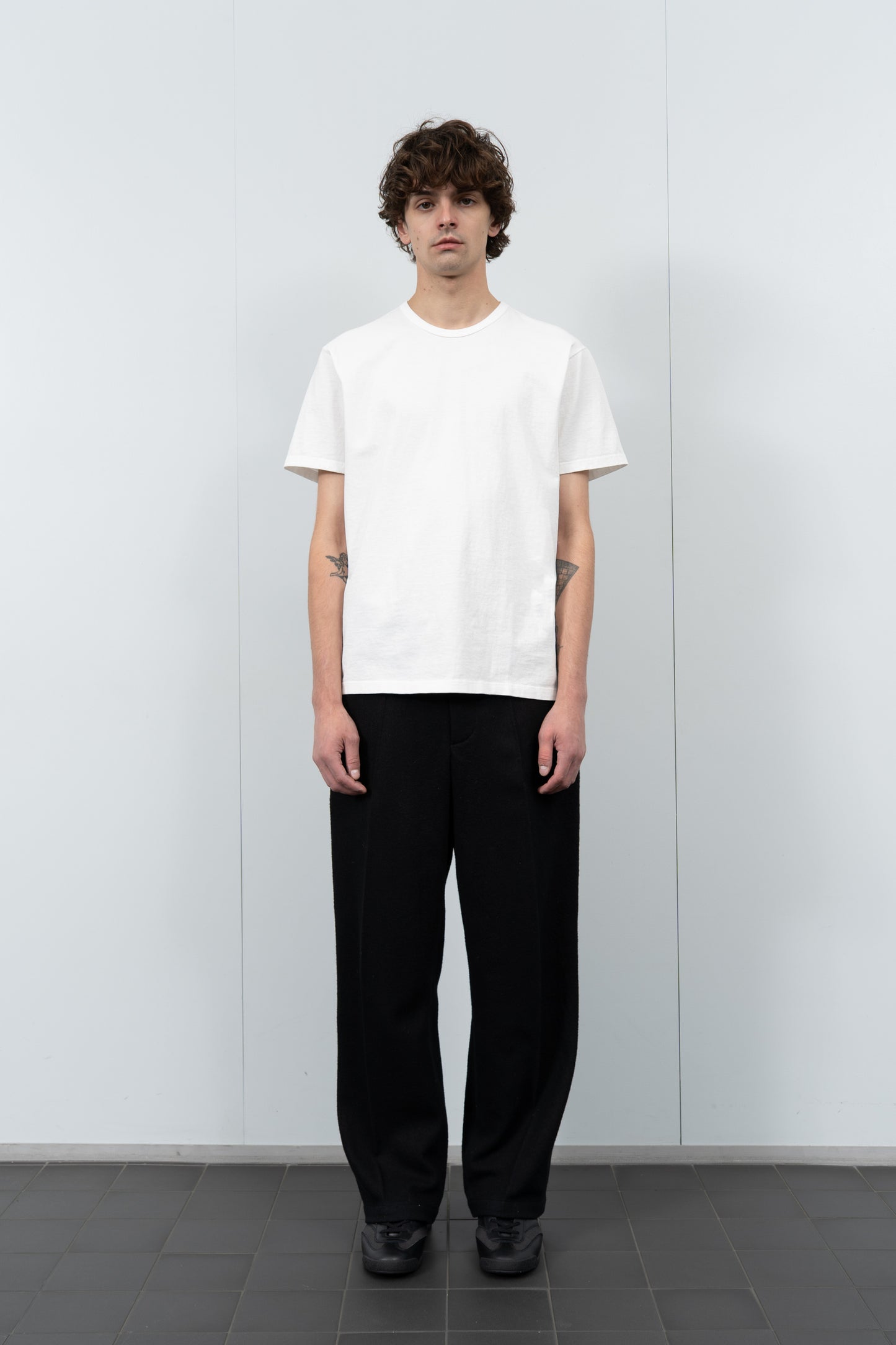 Model poses in LW101 Our T-shirt in white
