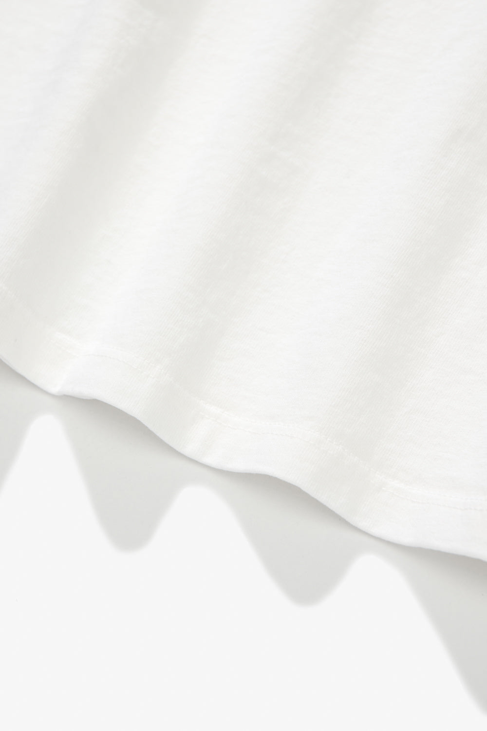 Close-up of fabric ripple of LW101 Our T-shirt in white