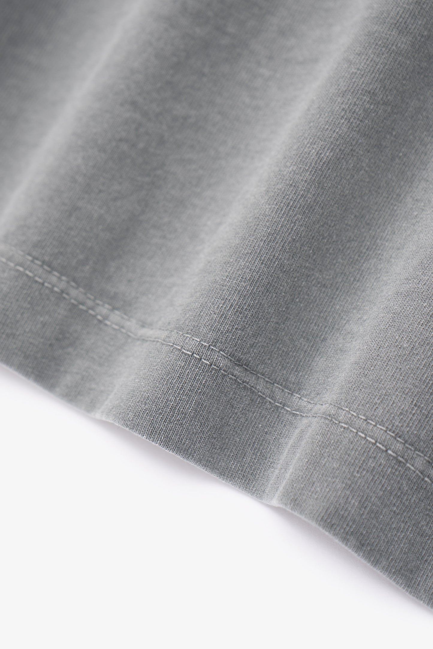 Close-up of fabric ripple of LW102 Municipal T-shirt in pigment kelp