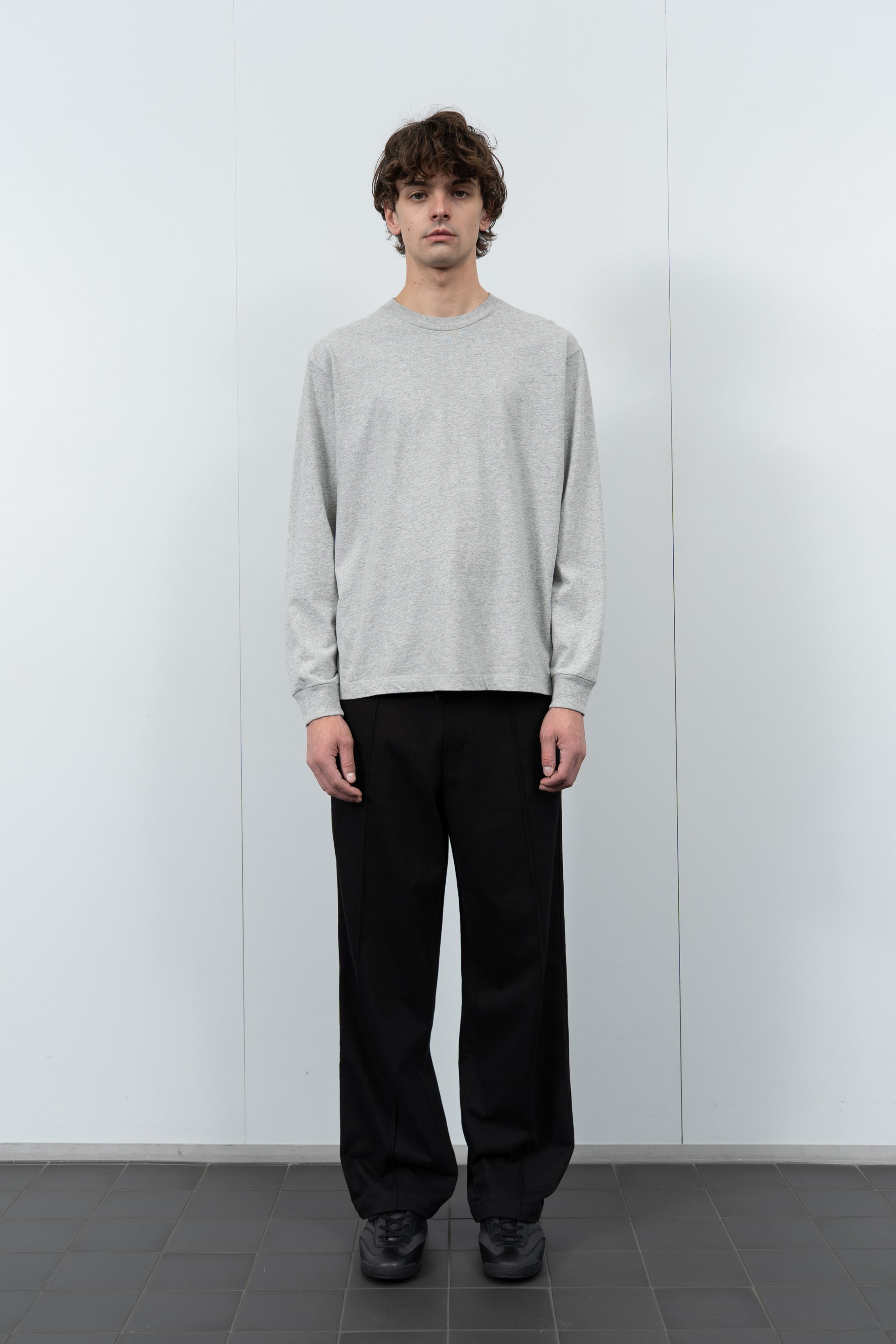 Model poses in LW102LS LS Municipal Pocket T-shirt in heather grey