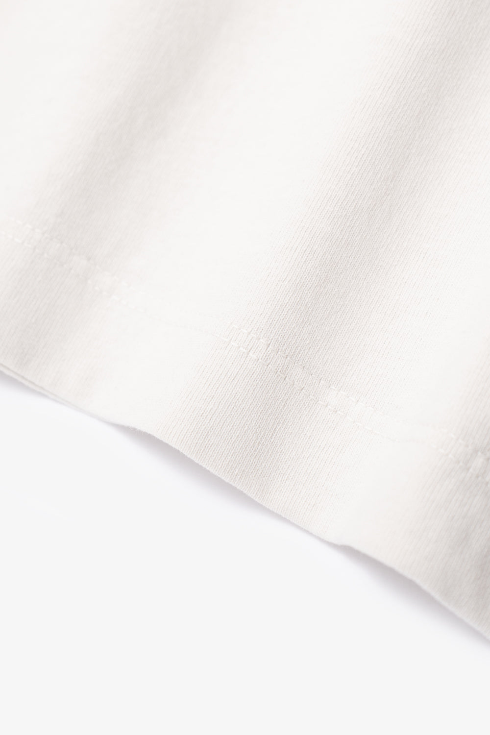 Close-up of fabric ripple of LW102LS LS Municipal Pocket T-shirt in Off White