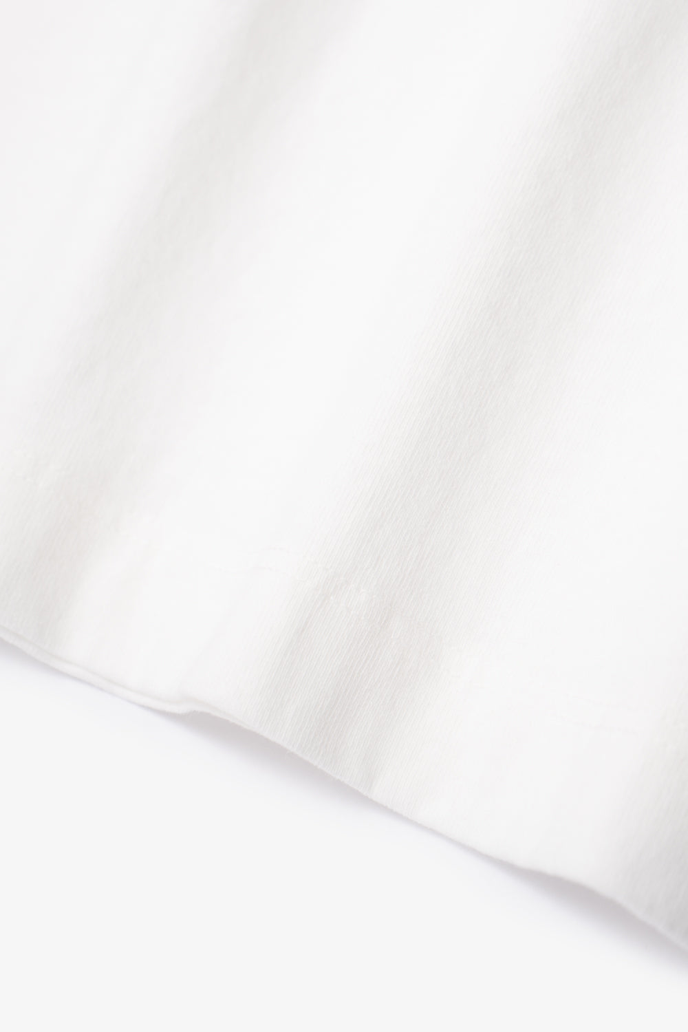 Close-up of fabric ripple of LW102LS LS Municipal Pocket T-shirt in white