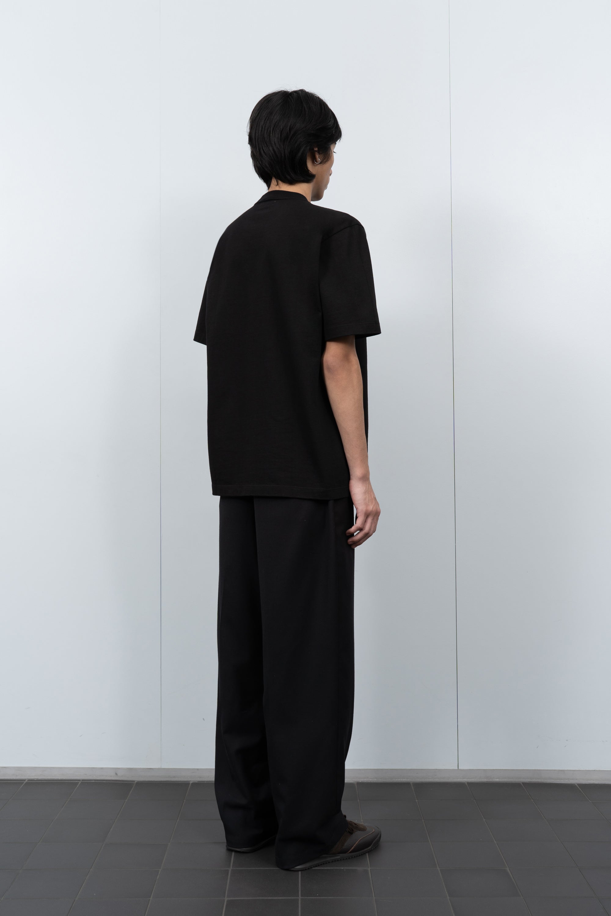 LW130T Rugby T-shirt in Black on a Model