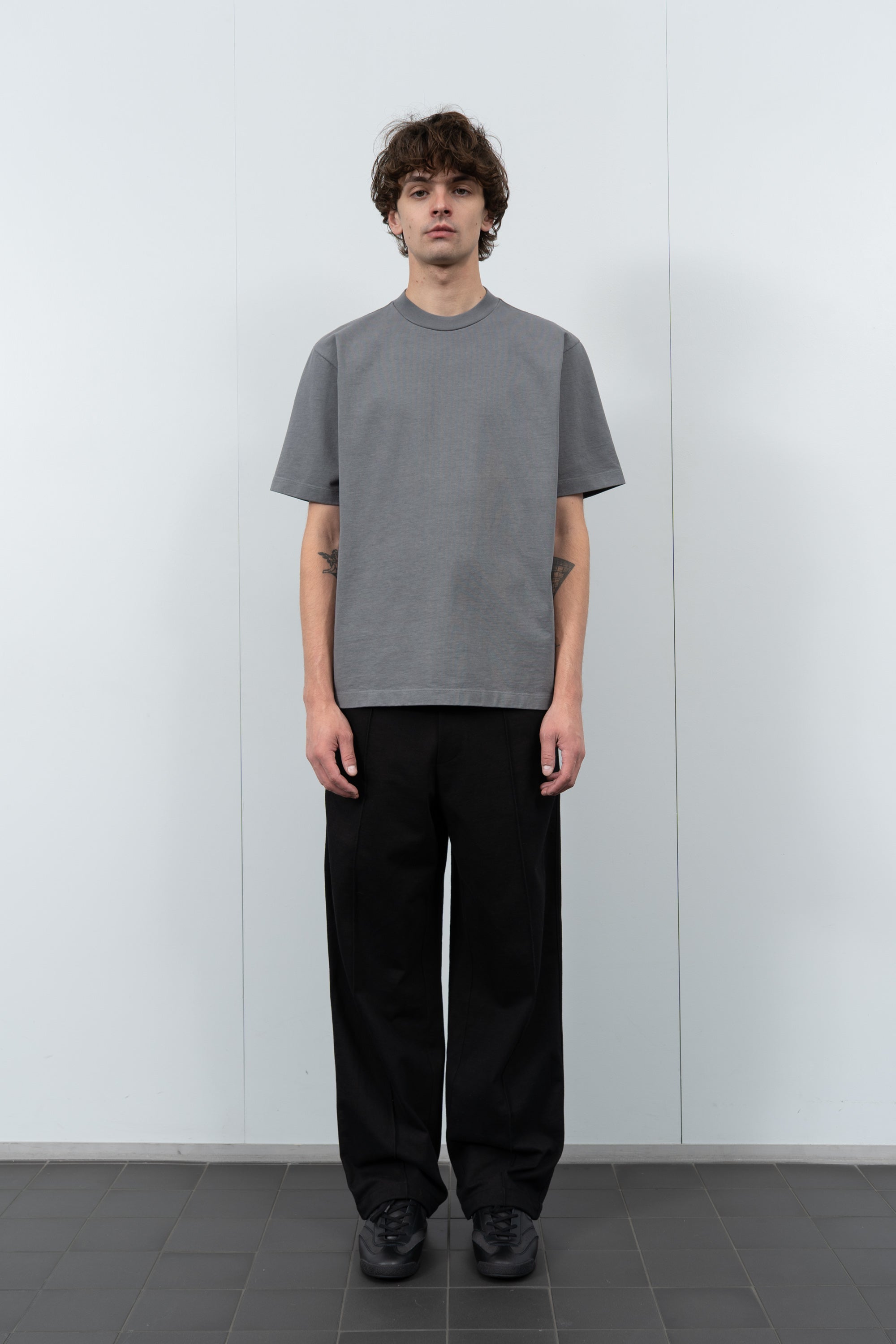 Model poses in LW130T Rugby T-shirt in kelp