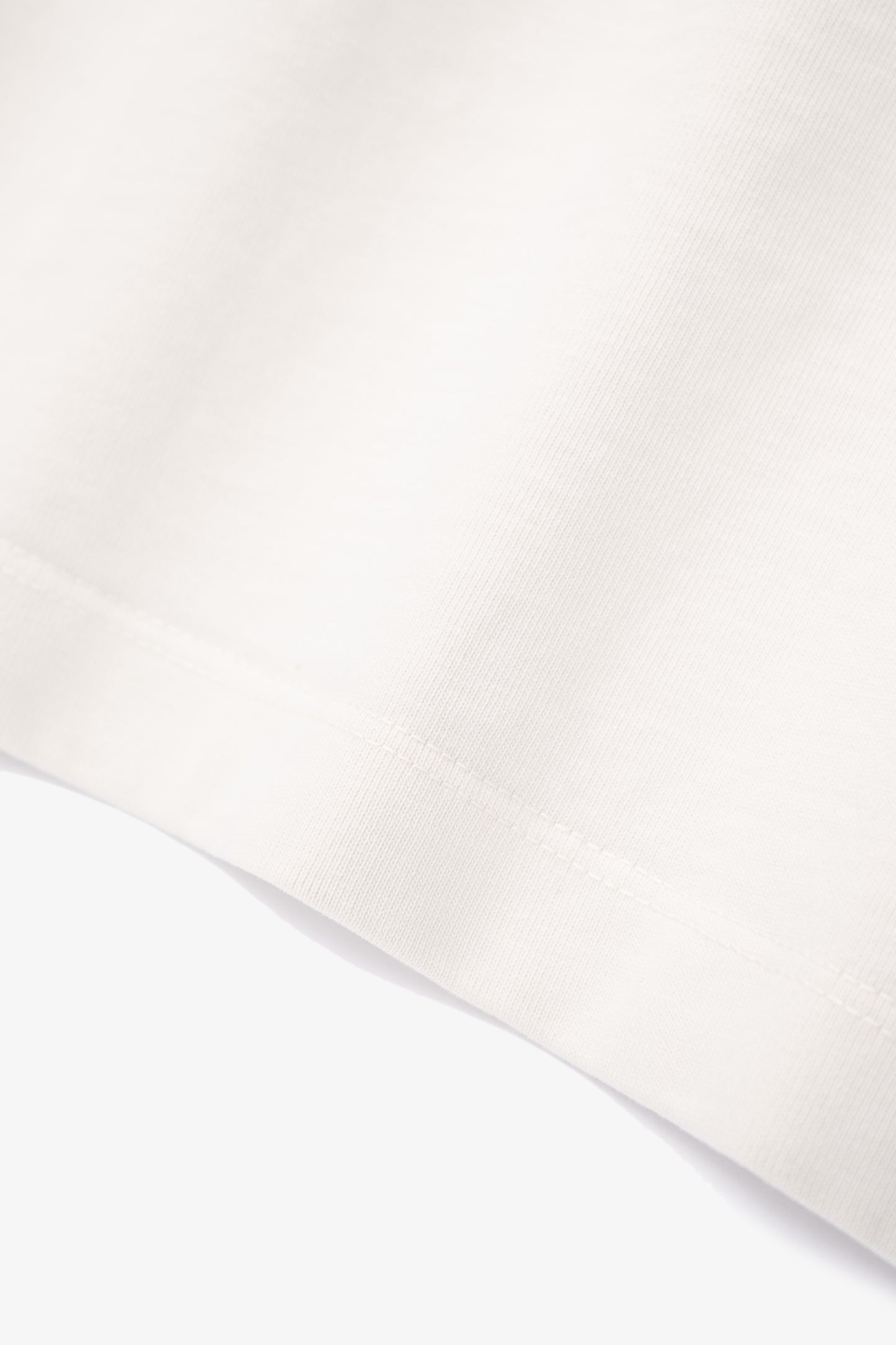 Close-up of fabric ripple of LW130T Rugby T-shirt in off white