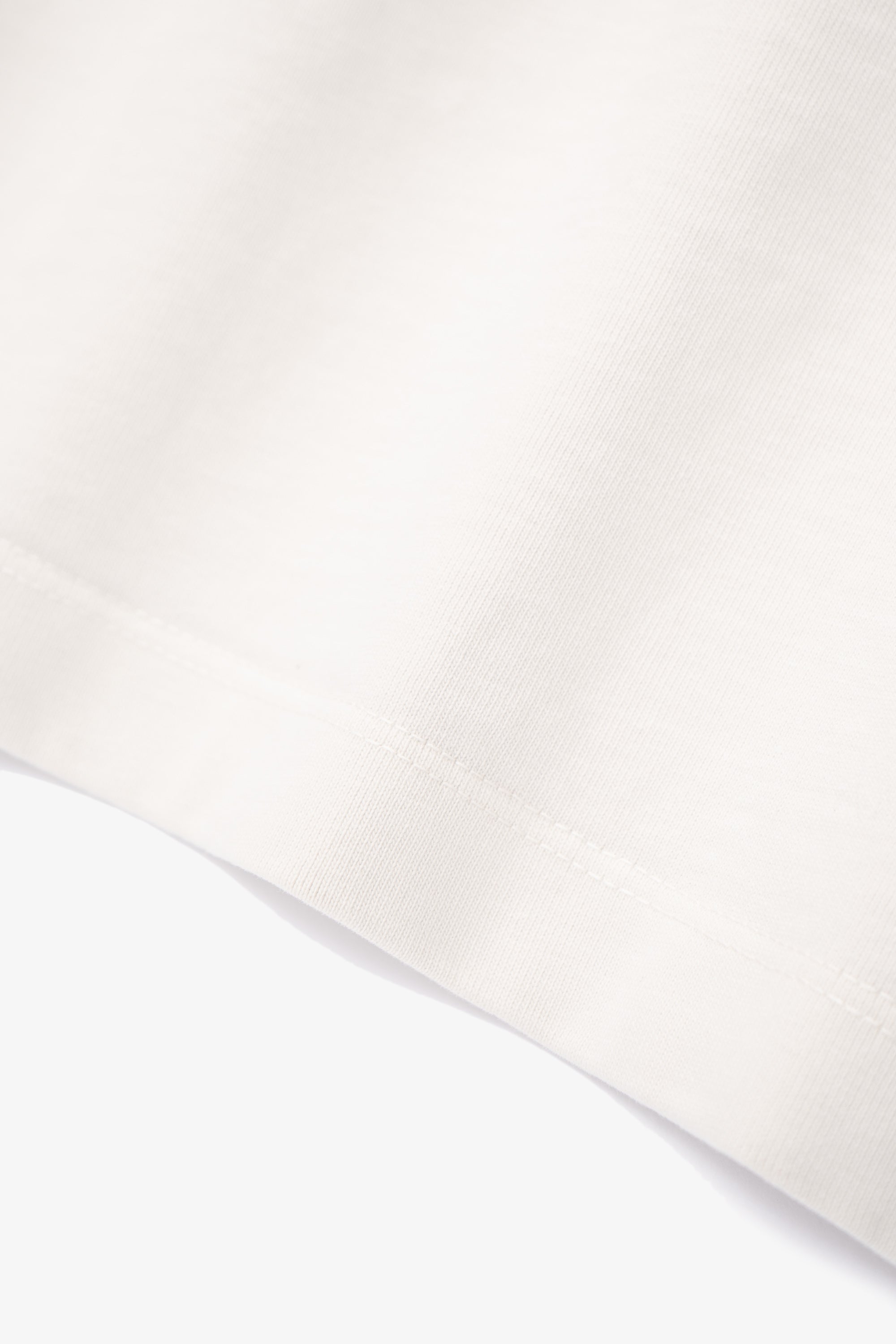 Close-up of fabric ripple of LW130T Rugby T-shirt in off white