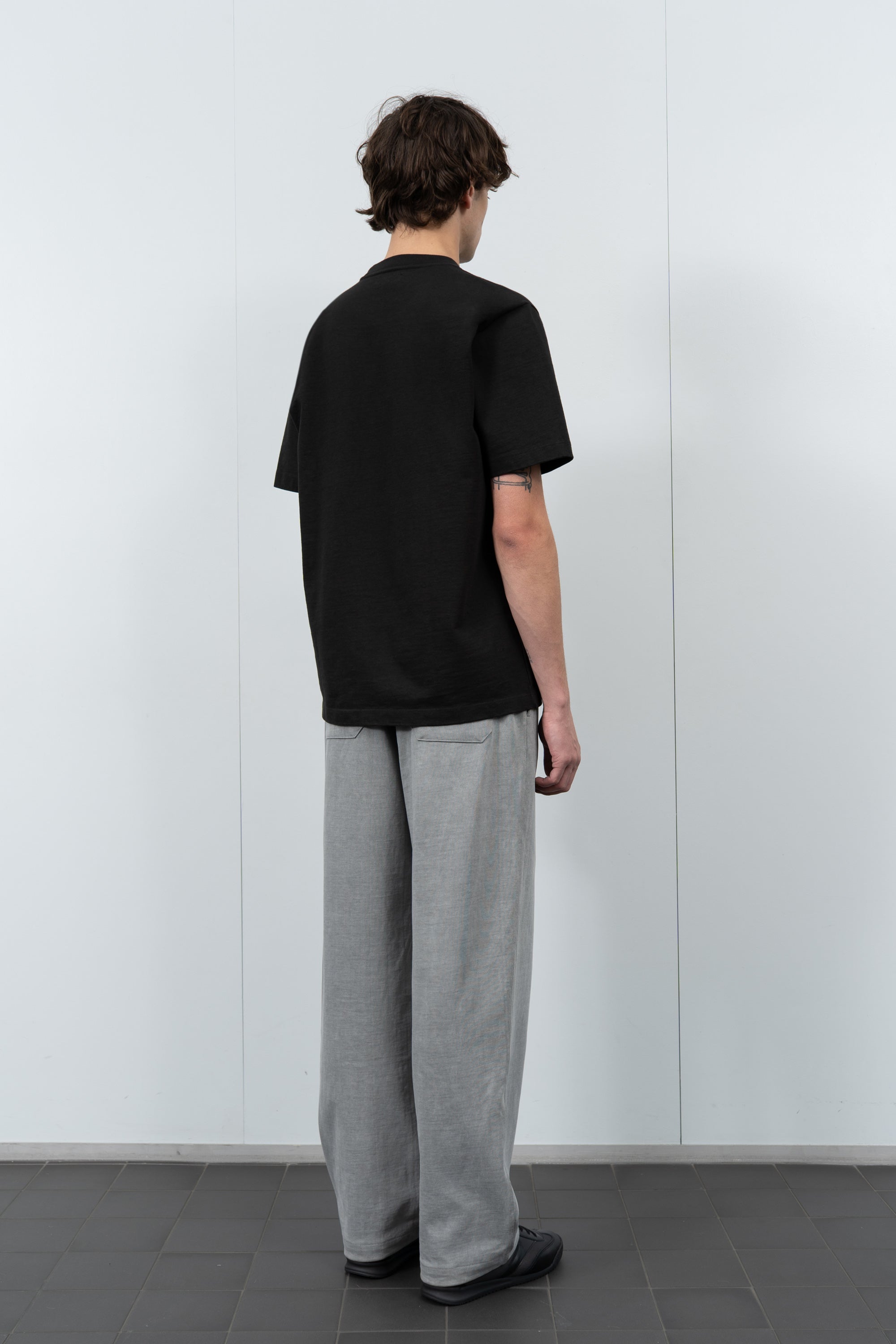 Model poses in LW130T Rugby T-shirt in Shadow