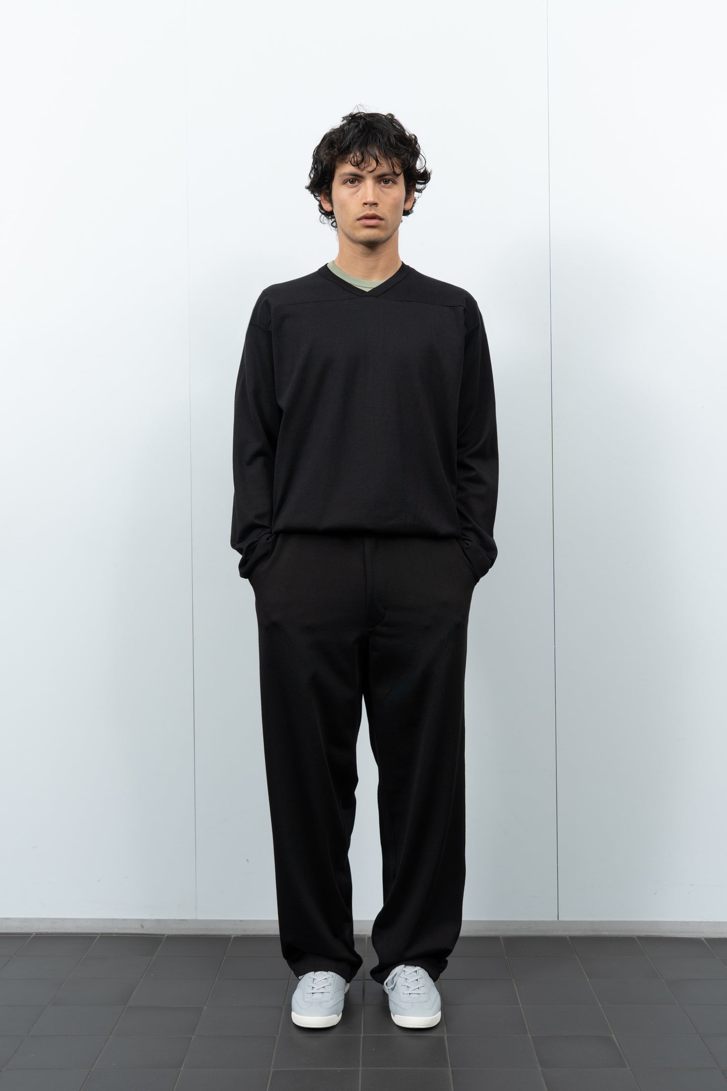 Front-facing on-model photograph of model wearing LW135 LS Football T-shirt in Black