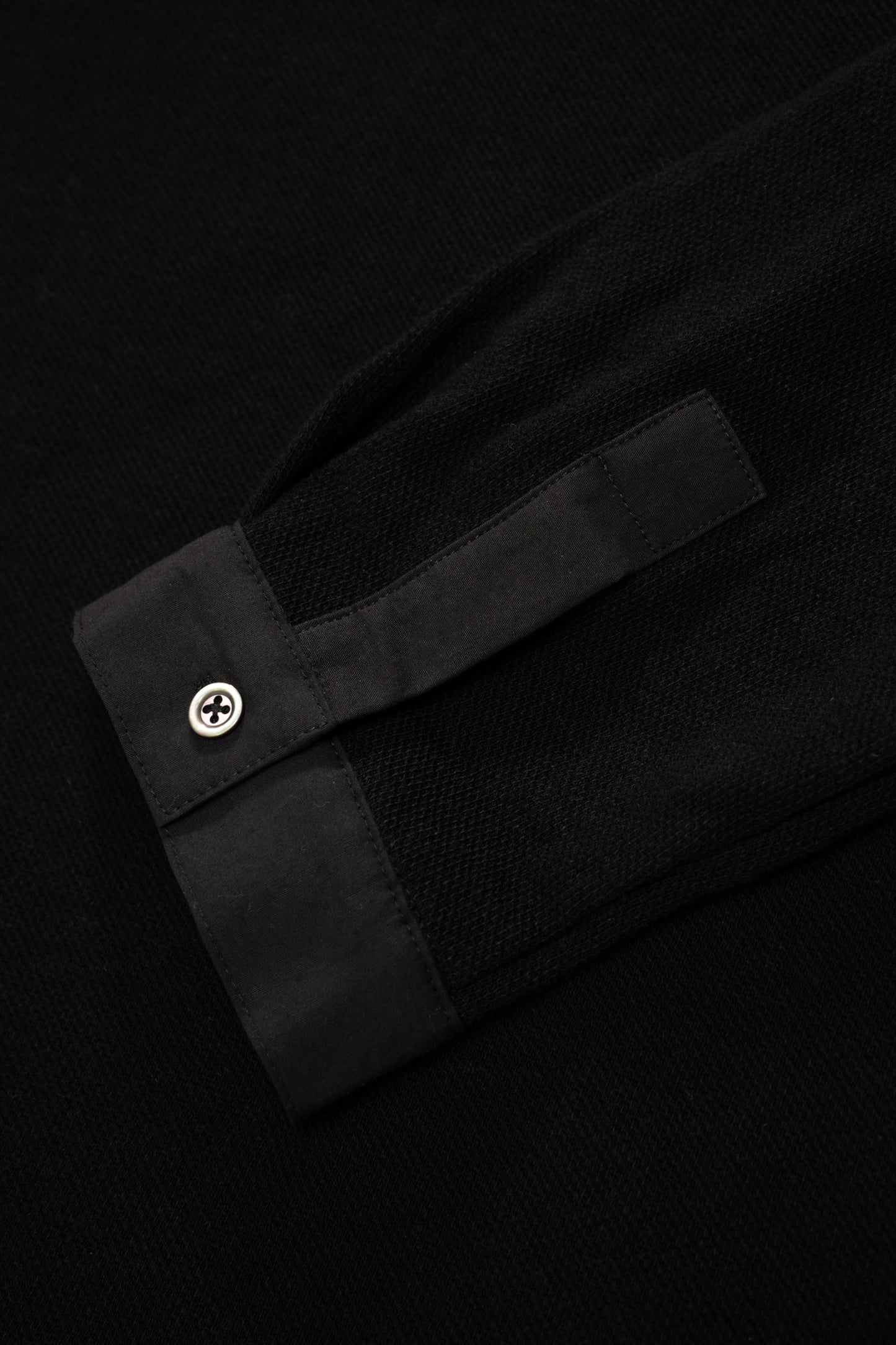 Cuff detail ofLW415CL Double Knit Polo in Black on a model