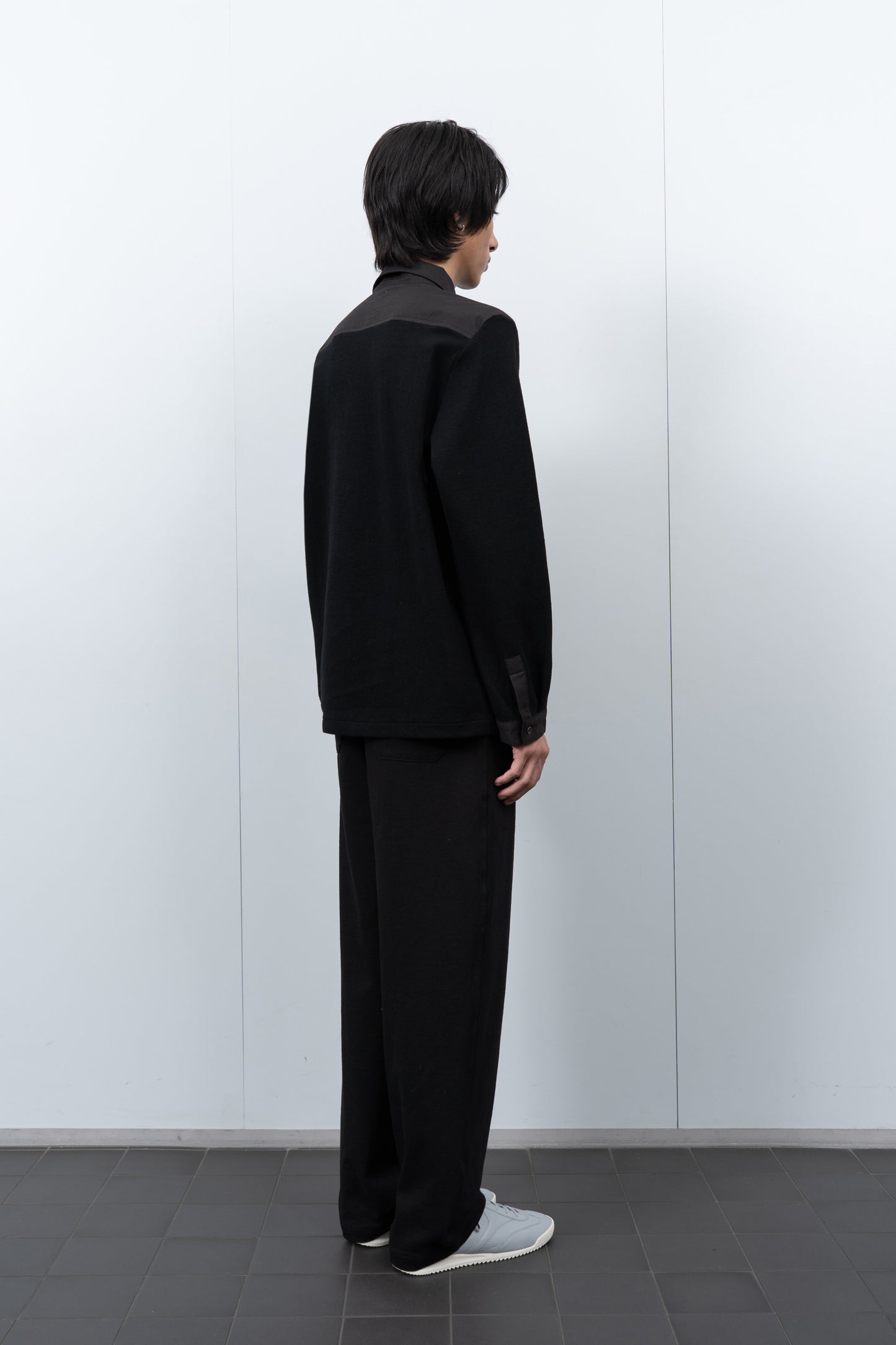 LW415CL Double Knit Polo in Black on a model