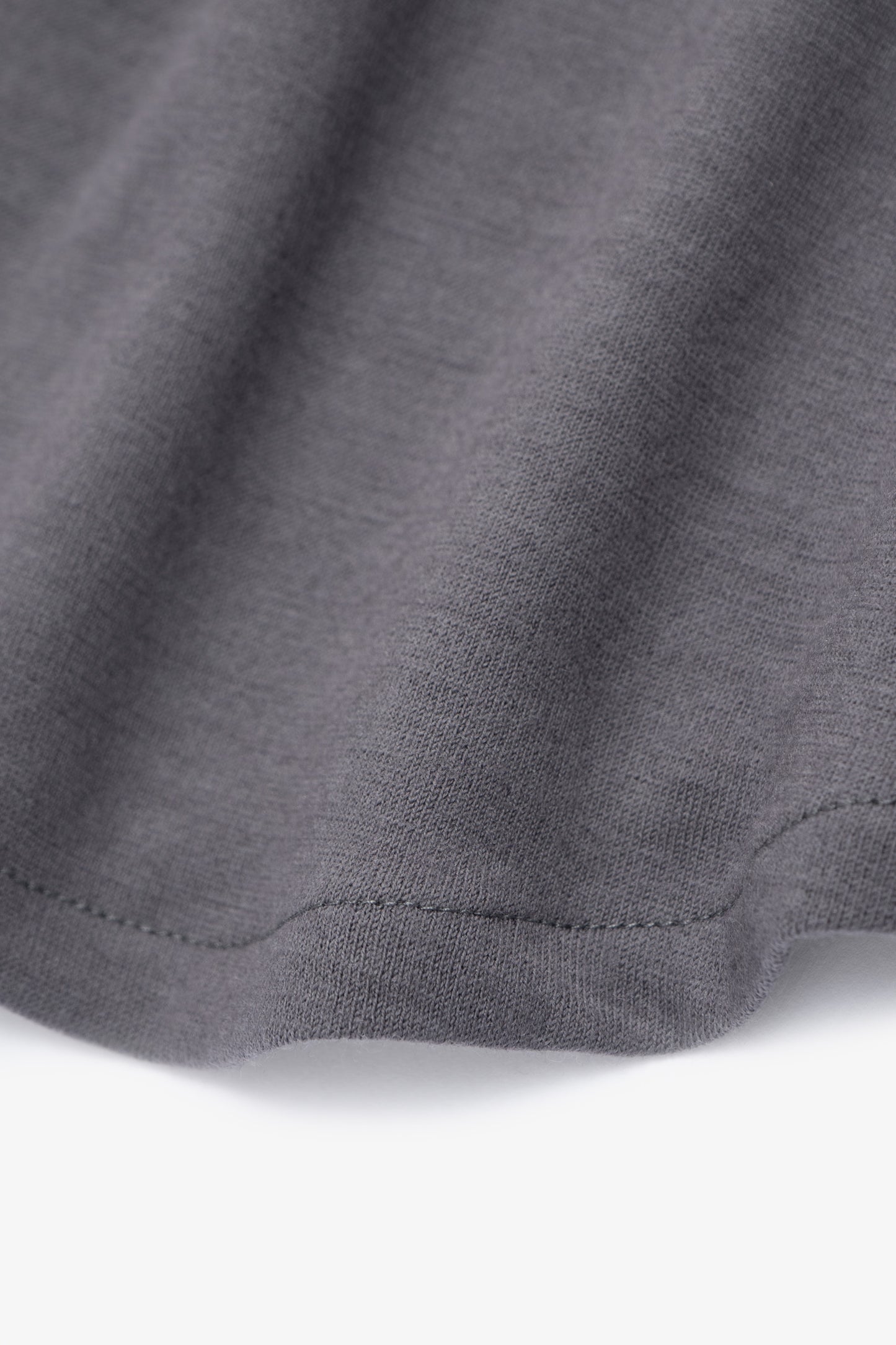 Close-up of hem of LW444W Wool Button up in slate grey