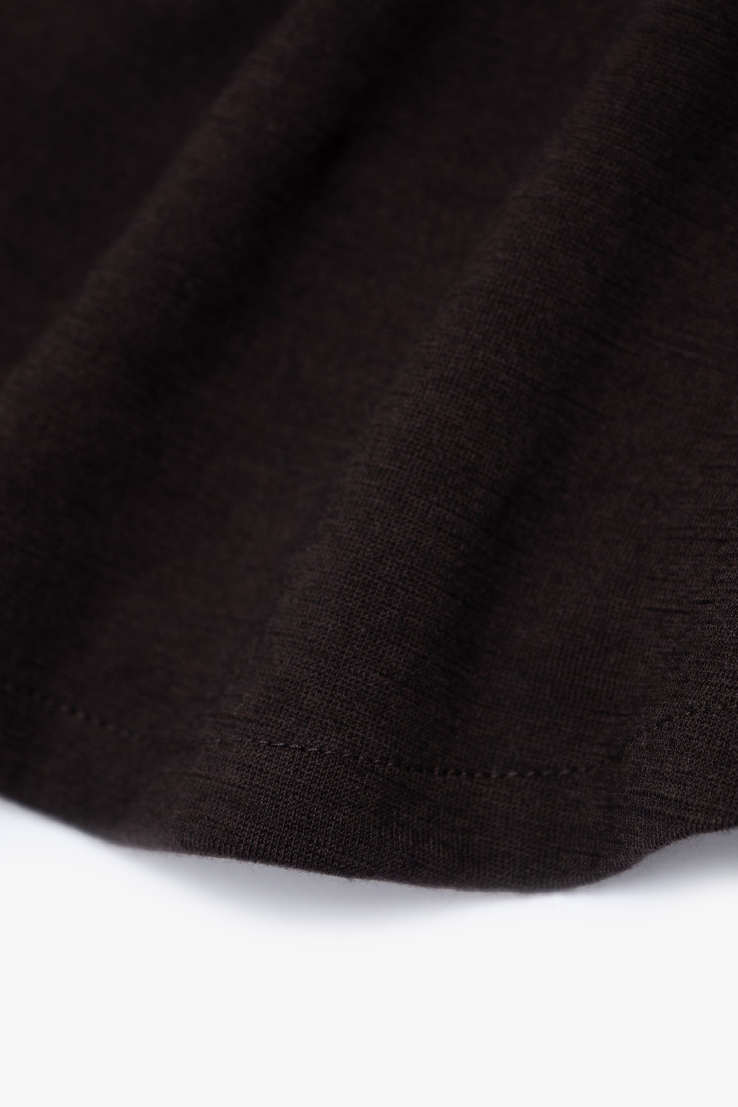 Close-up of hem of LW444W Wool Button up in woodberry