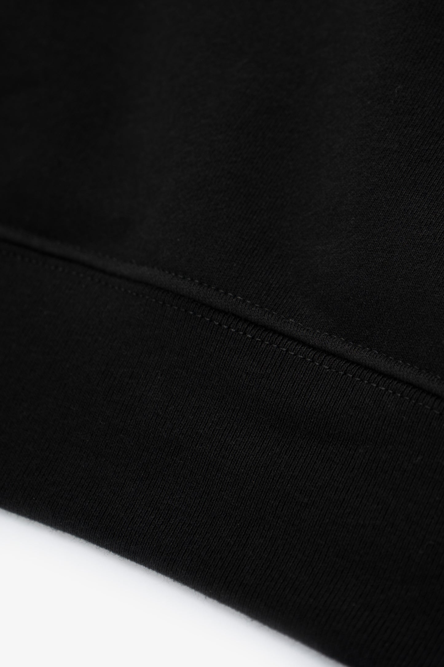 Hem detail of LW602 Cuff Off Raglan Sweatshirt in Black