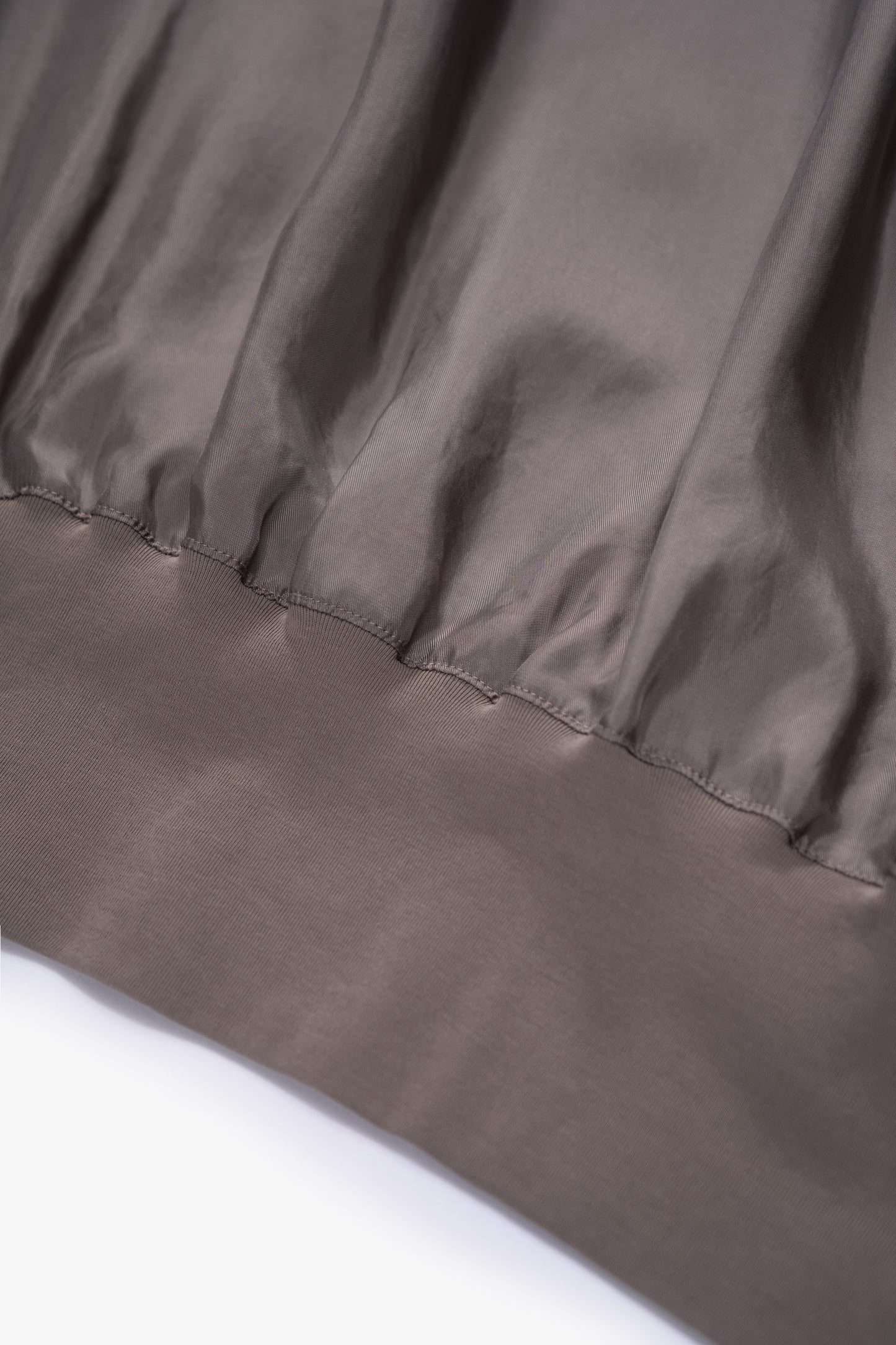 Hem detail of LW605 Cupro Pullover in Deep Grey