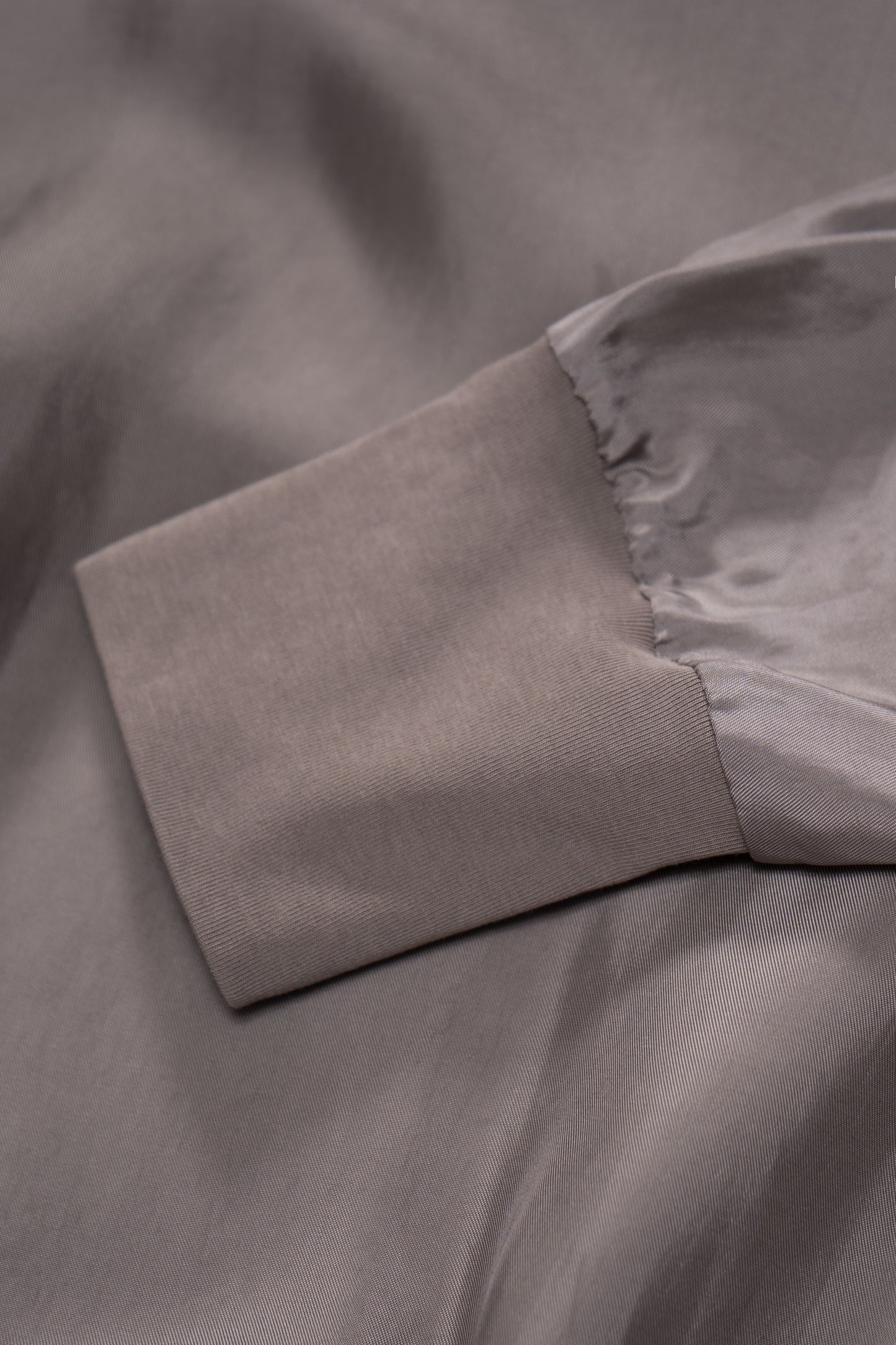 Cuff detail of LW605 Cupro Pullover in Deep Grey