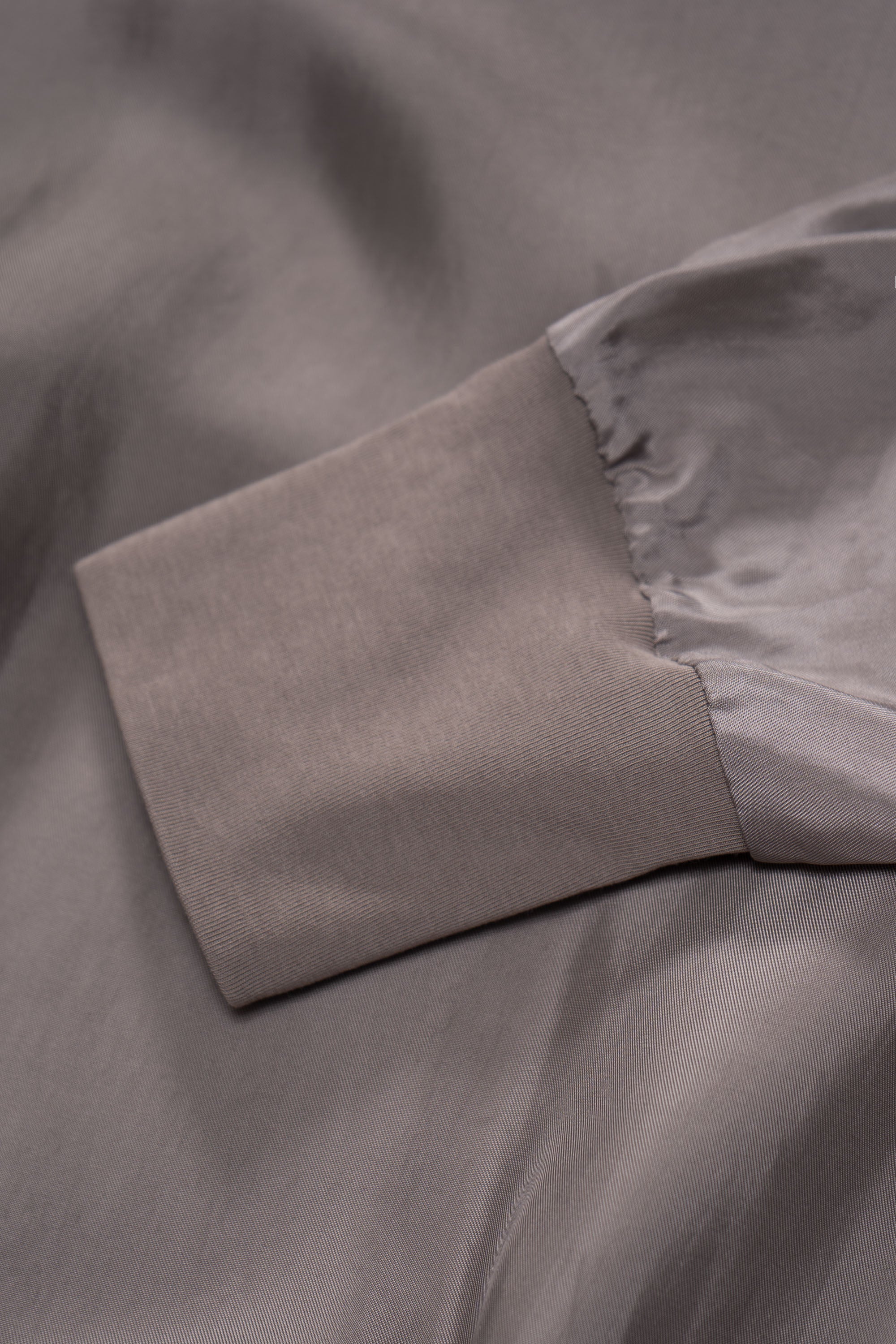 Cuff detail of LW605 Cupro Pullover in Deep Grey