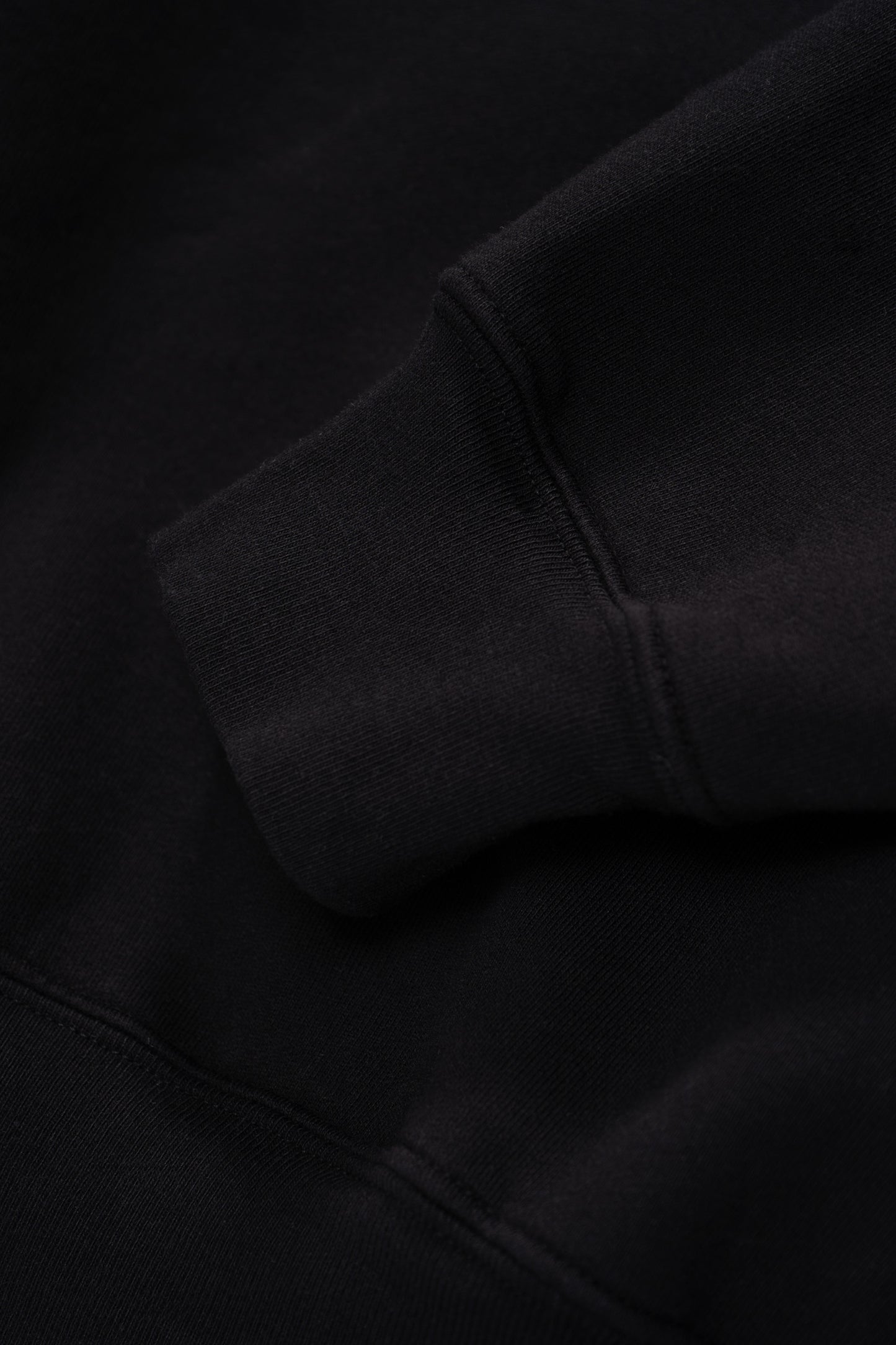 Cuff detail of LW612 Mini Crewneck in Black