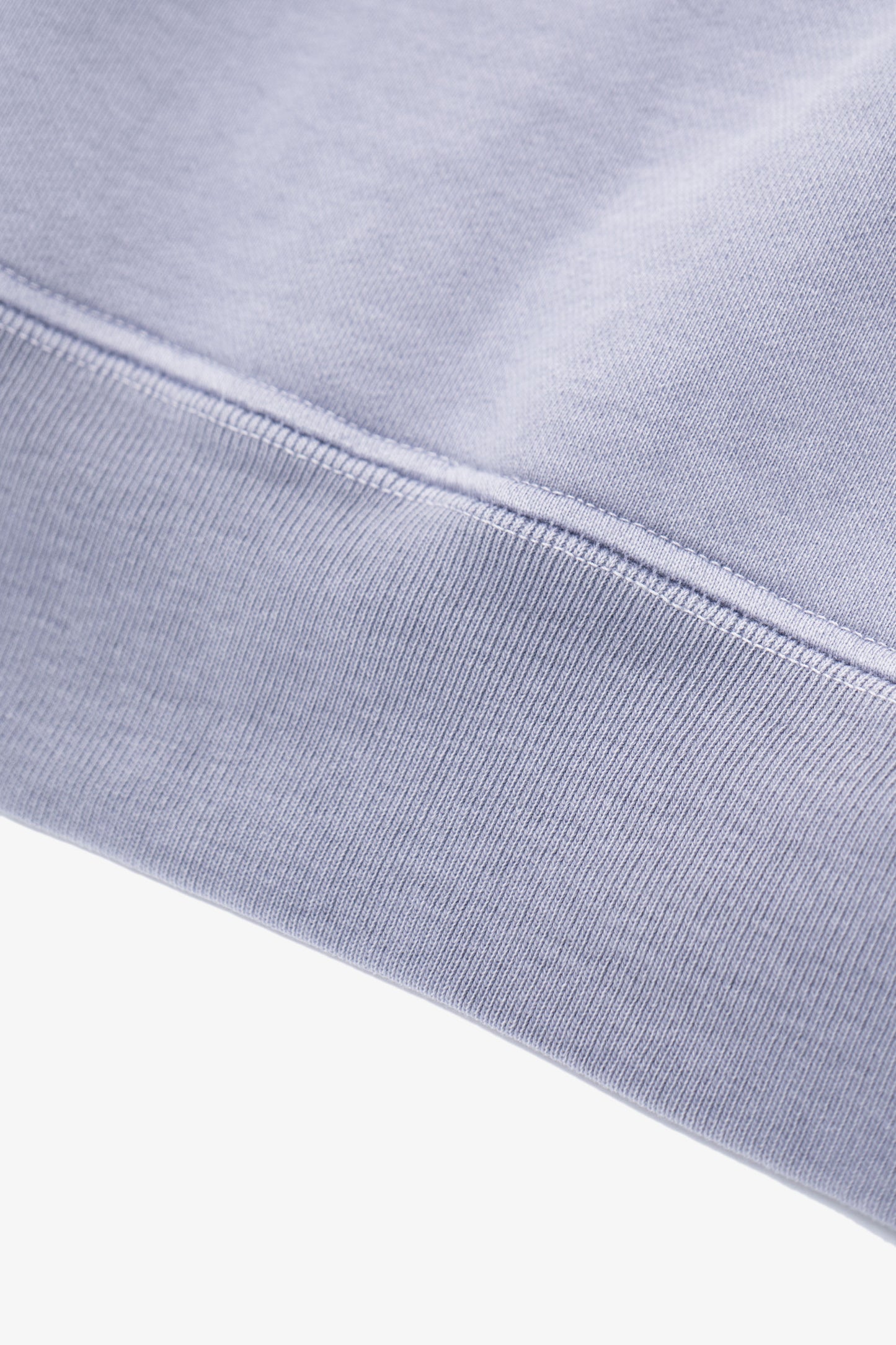 Close-up of waistband ribbing of LW620 Heavy Gusset Crewneck in lilac grey