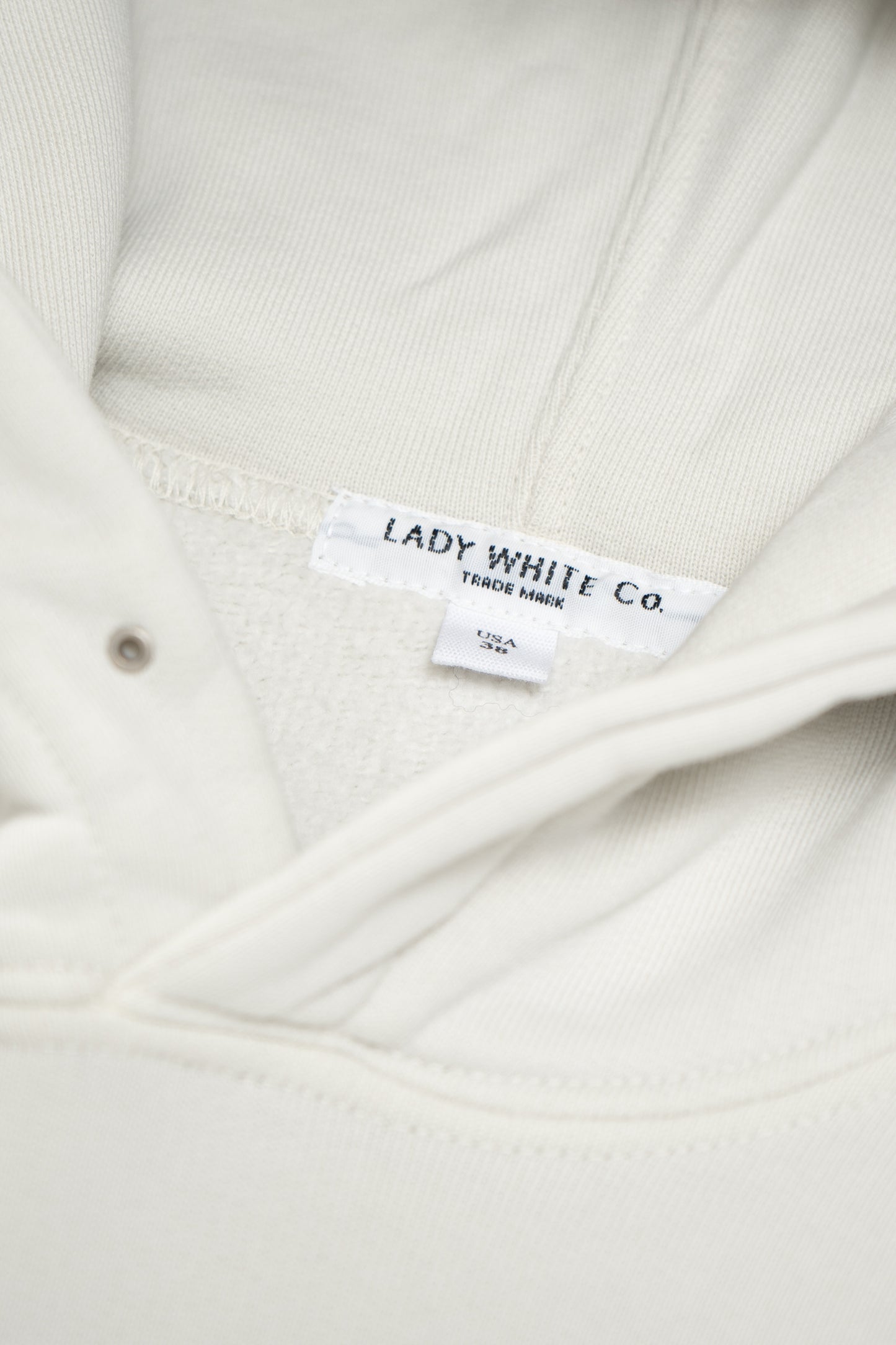 Collar detail of LW624 Mini Hoodie in Off White