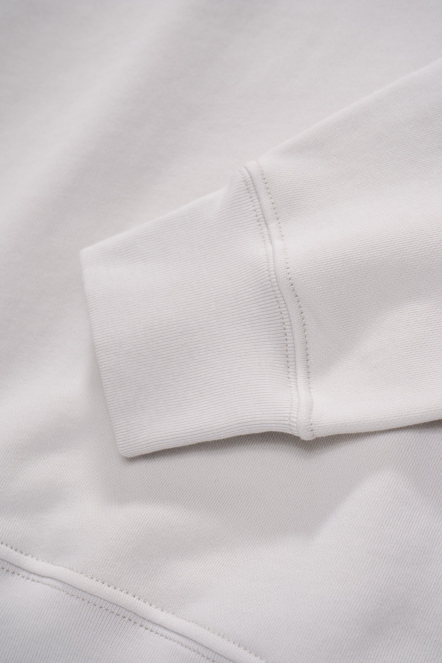 Cuff detail of LW635 Anderson Quarter Zip in Off White