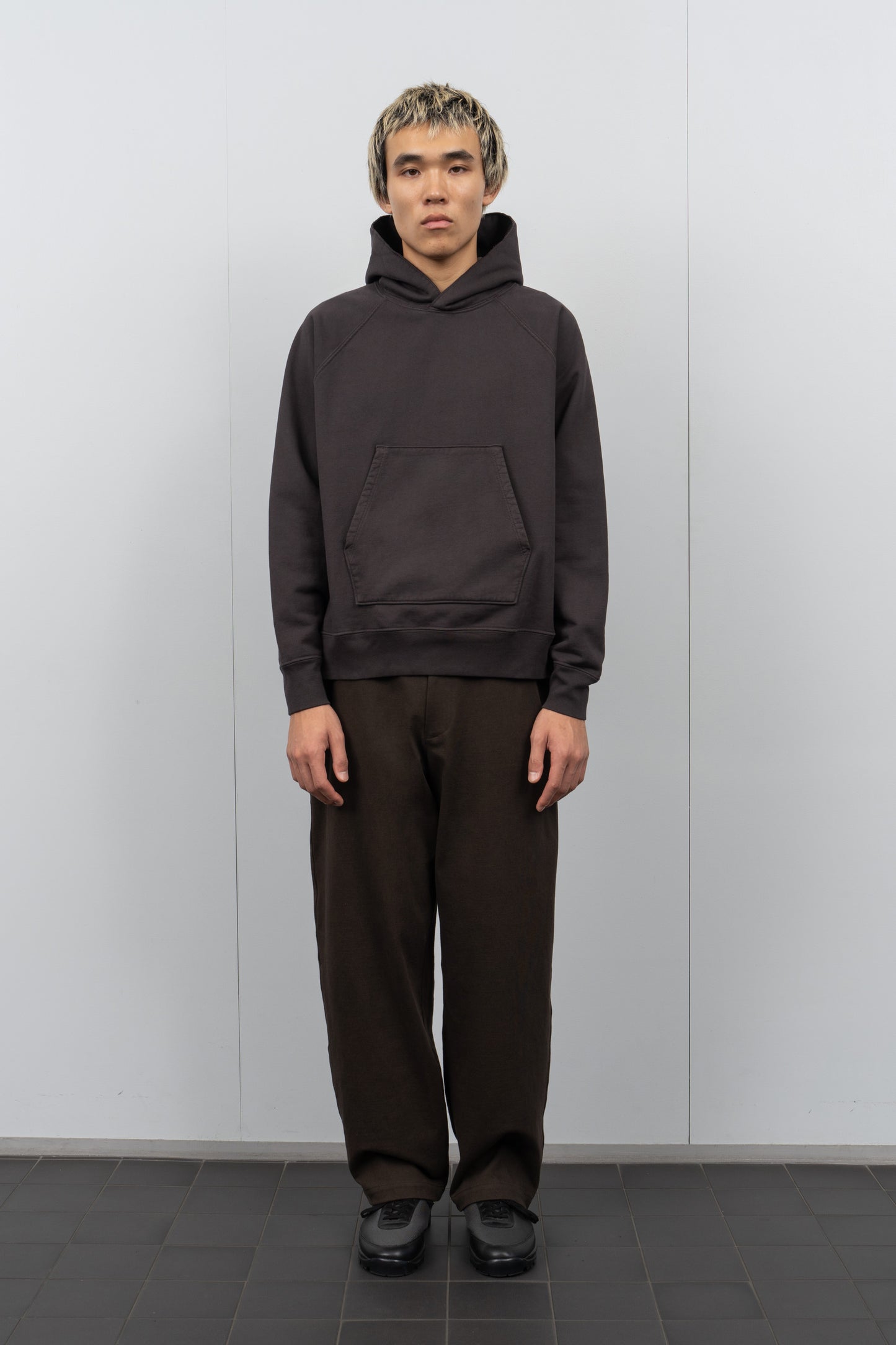 LW680 Super Weighted Hoodie in Tire Black on a model