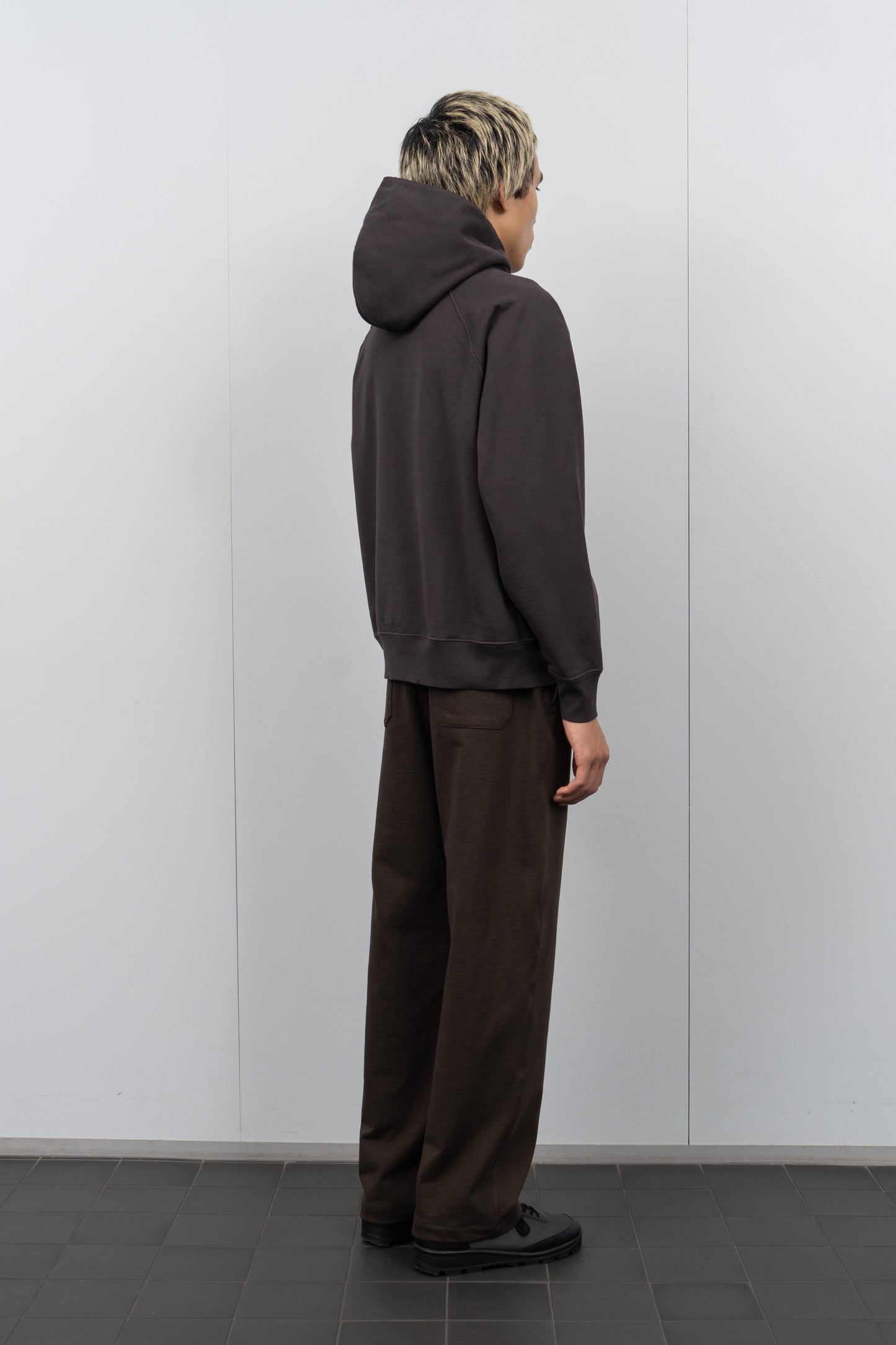 LW680 Super Weighted Hoodie in Tire Black on a model
