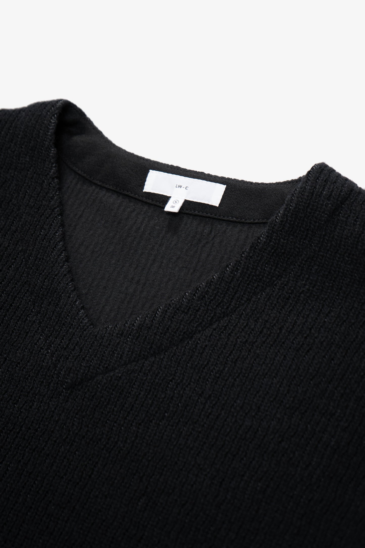 Close-up of collar of LW770CW V Neck Snap Sweater in black
