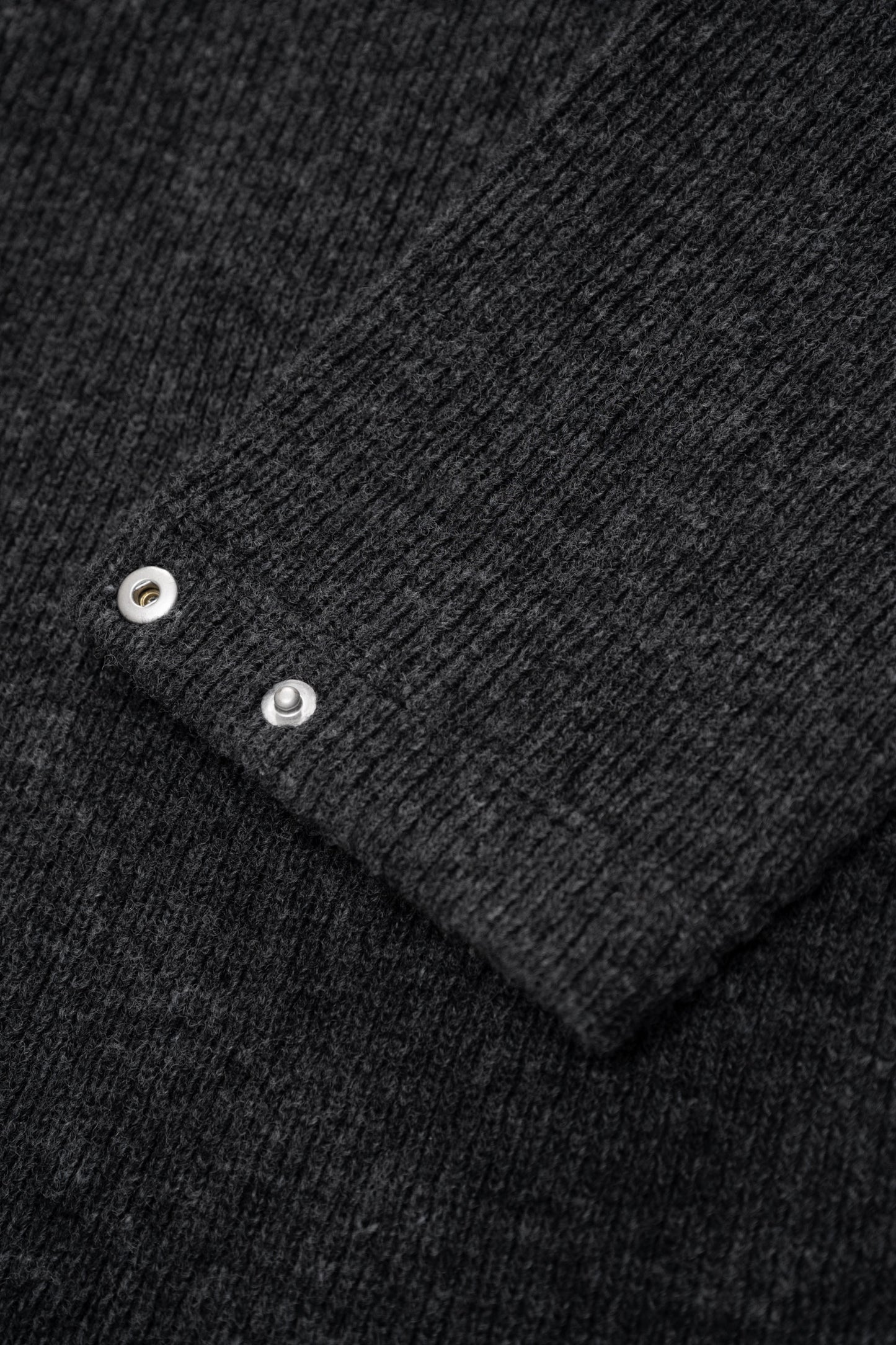 Close-up of rear waist of LW770CW V Neck Snap Sweater, showing snaps
