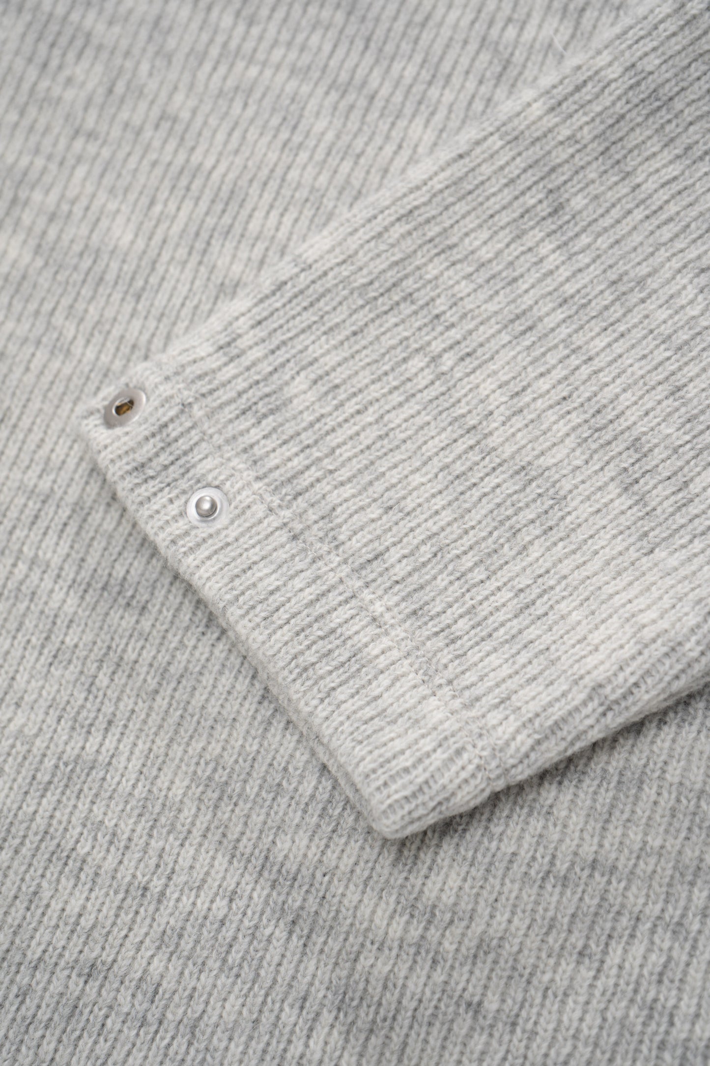 Close-up of cuff of LW770CW V Neck Snap Sweater in oatmeal, snaps on cuff