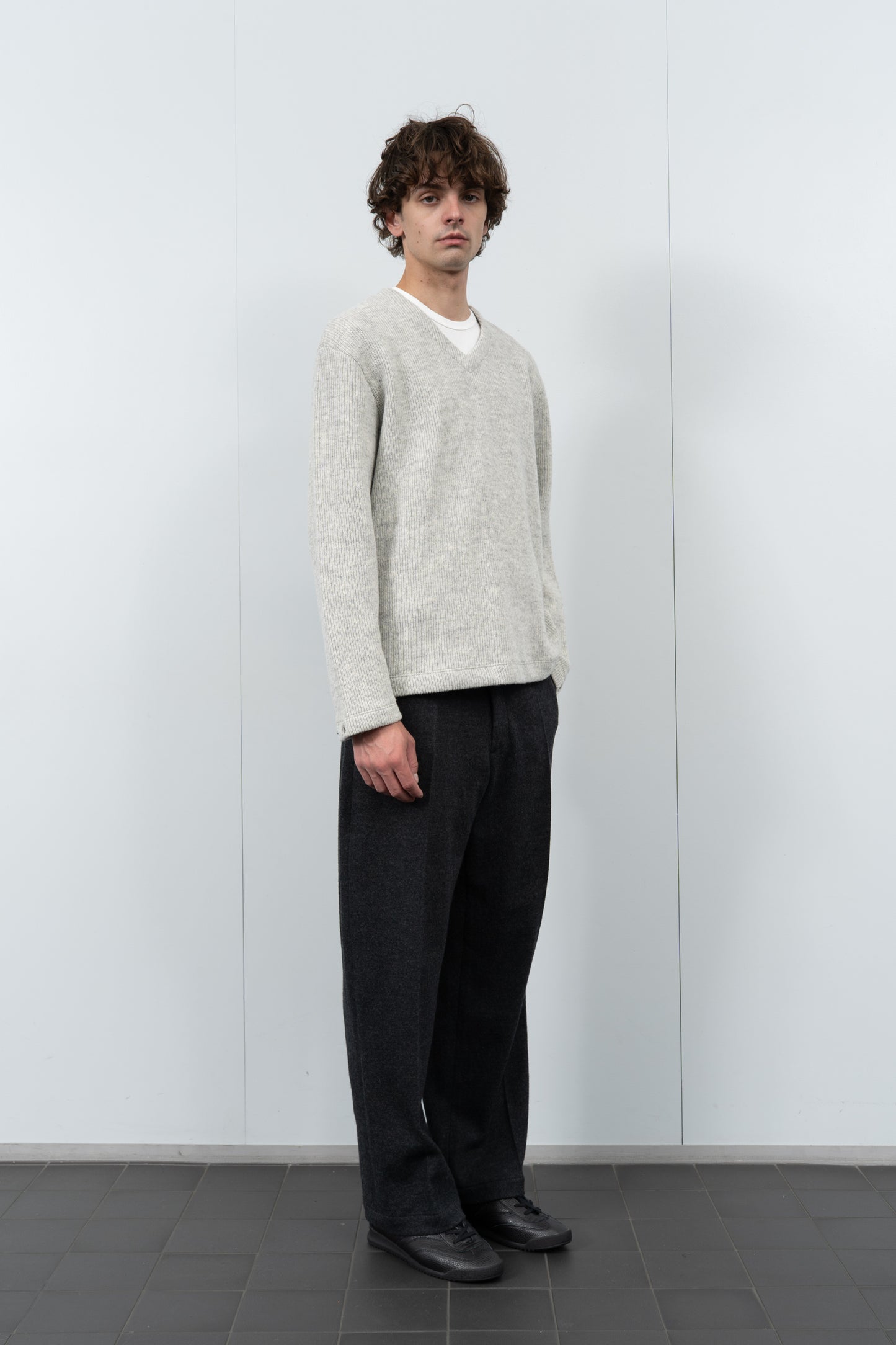 Model poses in LW770CW V Neck Snap Sweater in oatmeal
