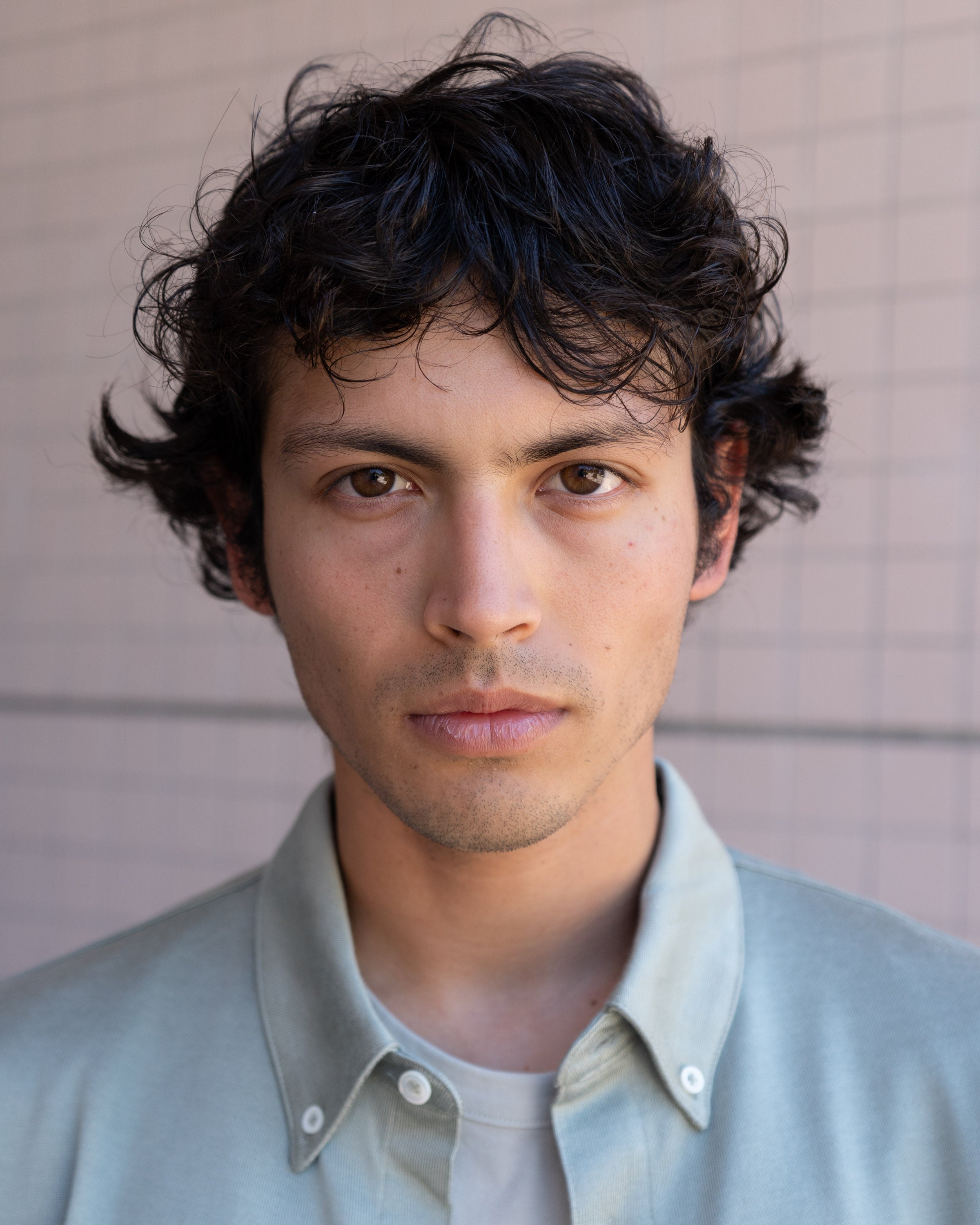 Close-up portrait of model wearing a LW423CR SS CR Button Down in Pistachio