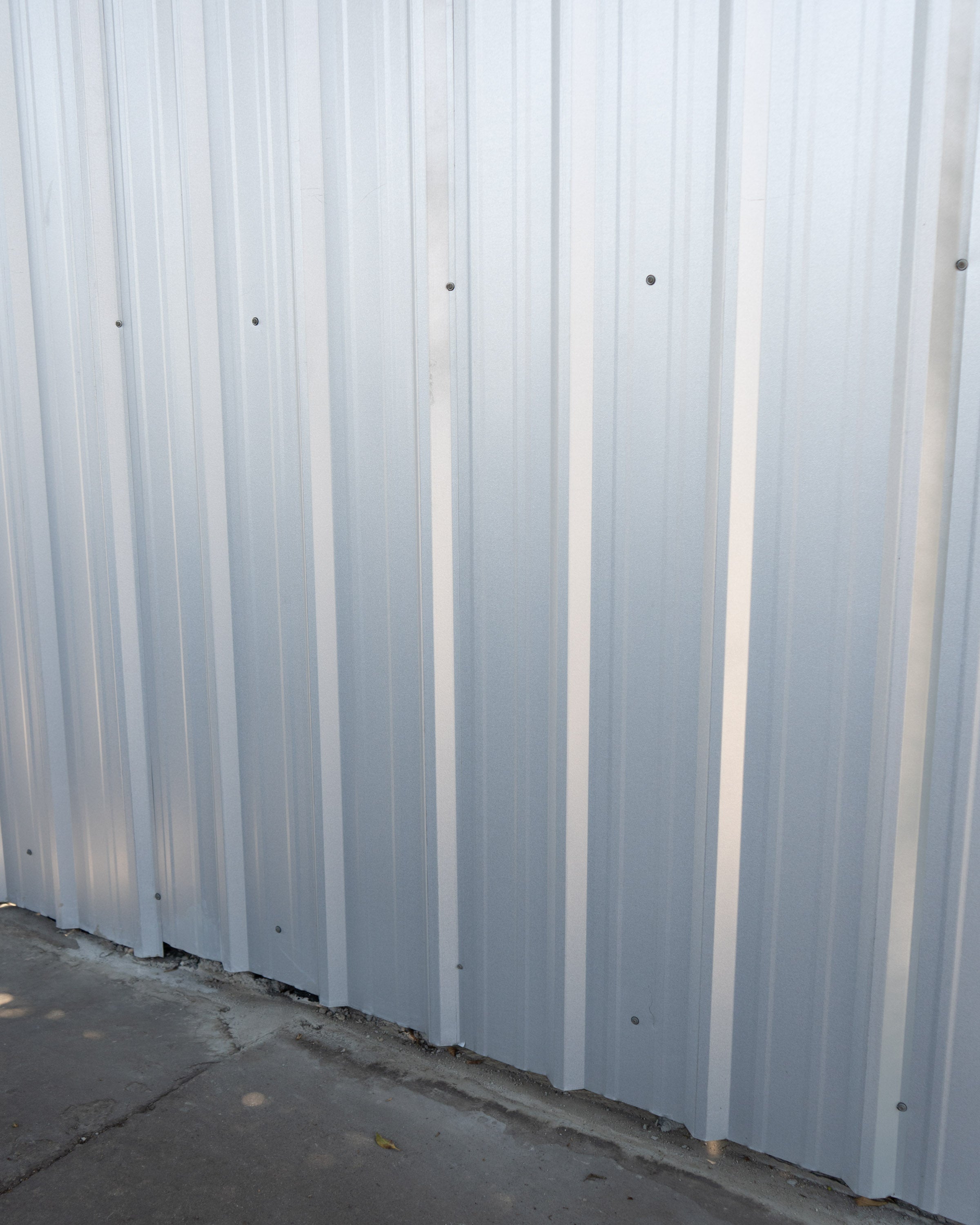 A still photograph of a corrugated metal side