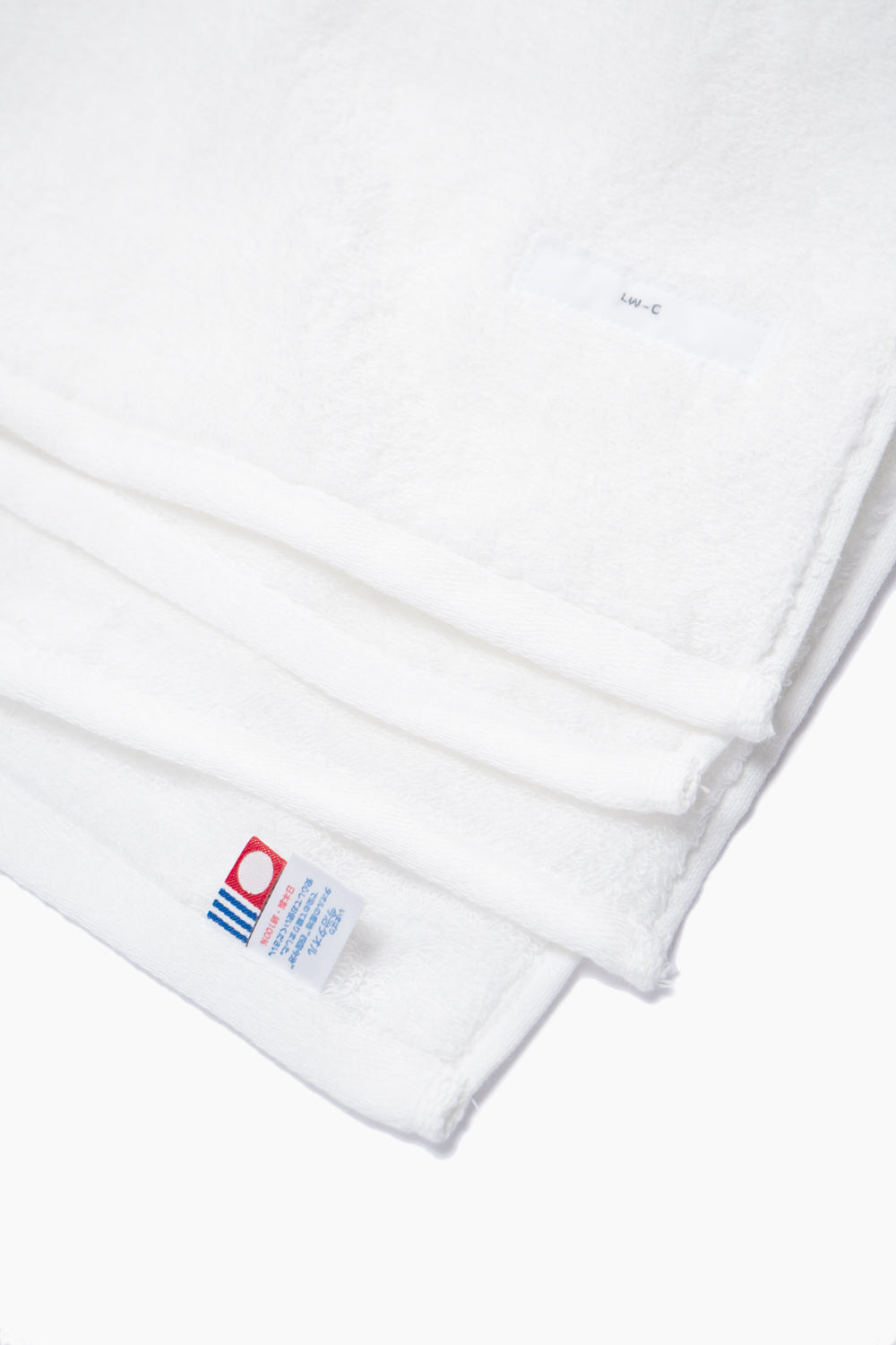 Corners of bath towels, showing label