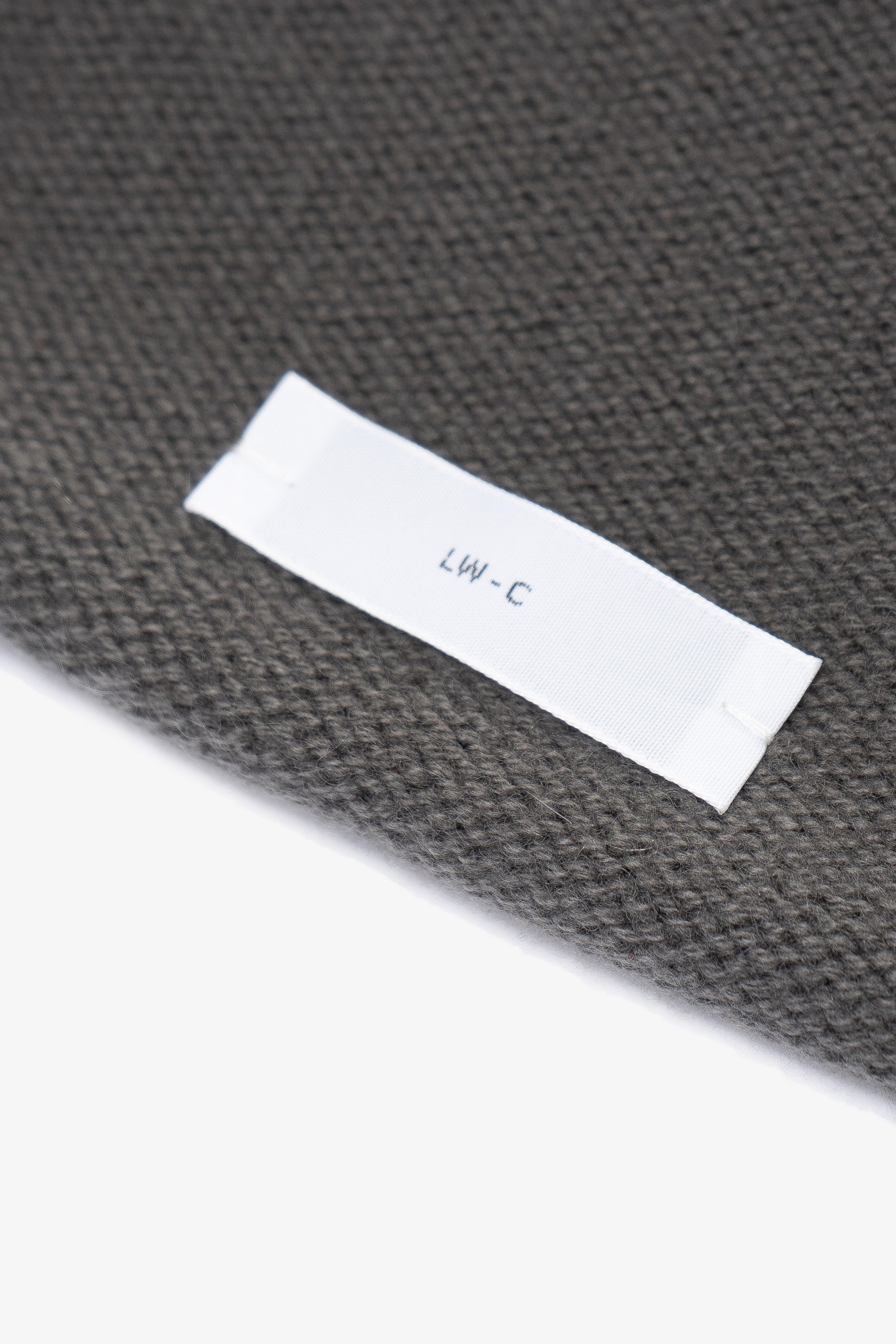 Close-up of fabric and tag of LW036 Ambrosia Beanie in marine gray