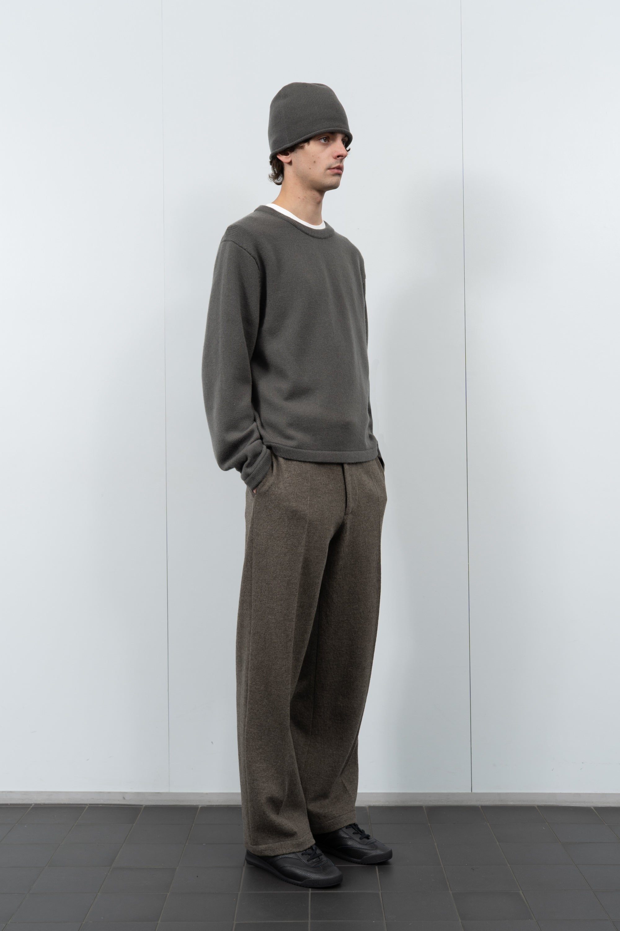 Full-length model poses wearing LW036 Ambrosia beanie in marine gray