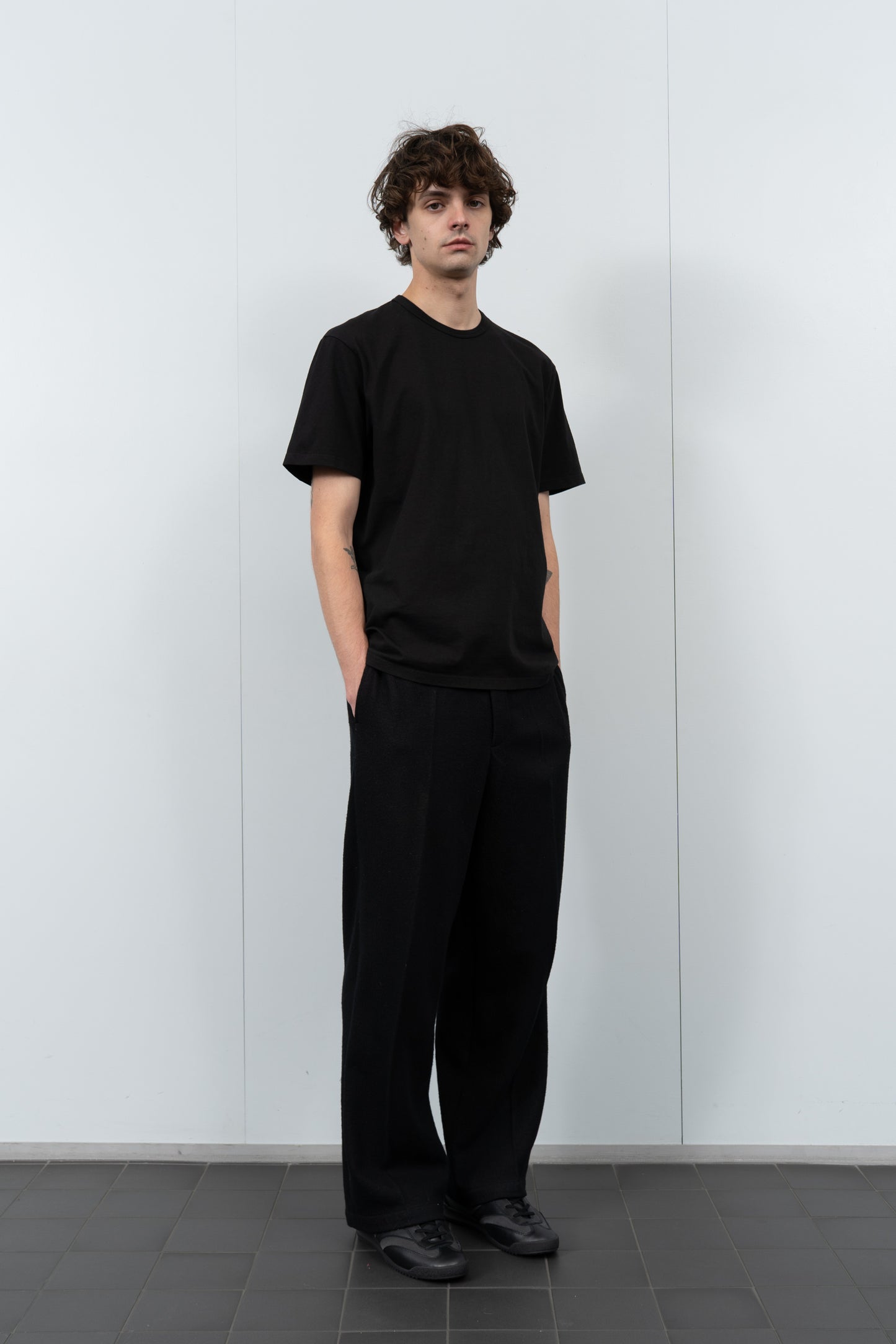 Full-length flat-lay photo of LW101 Our T-shirt in black