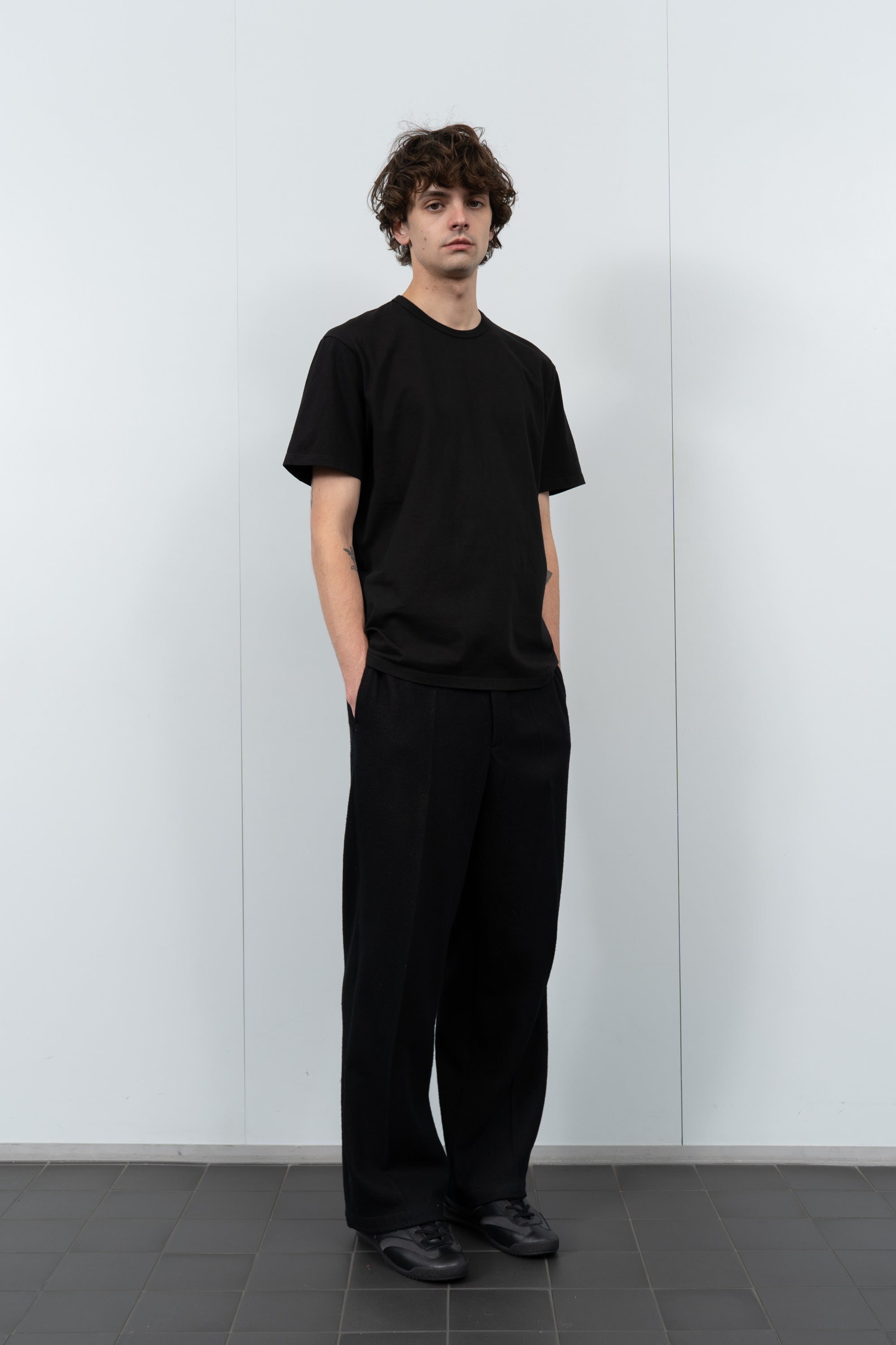 Full-length flat-lay photo of LW101 Our T-shirt in black
