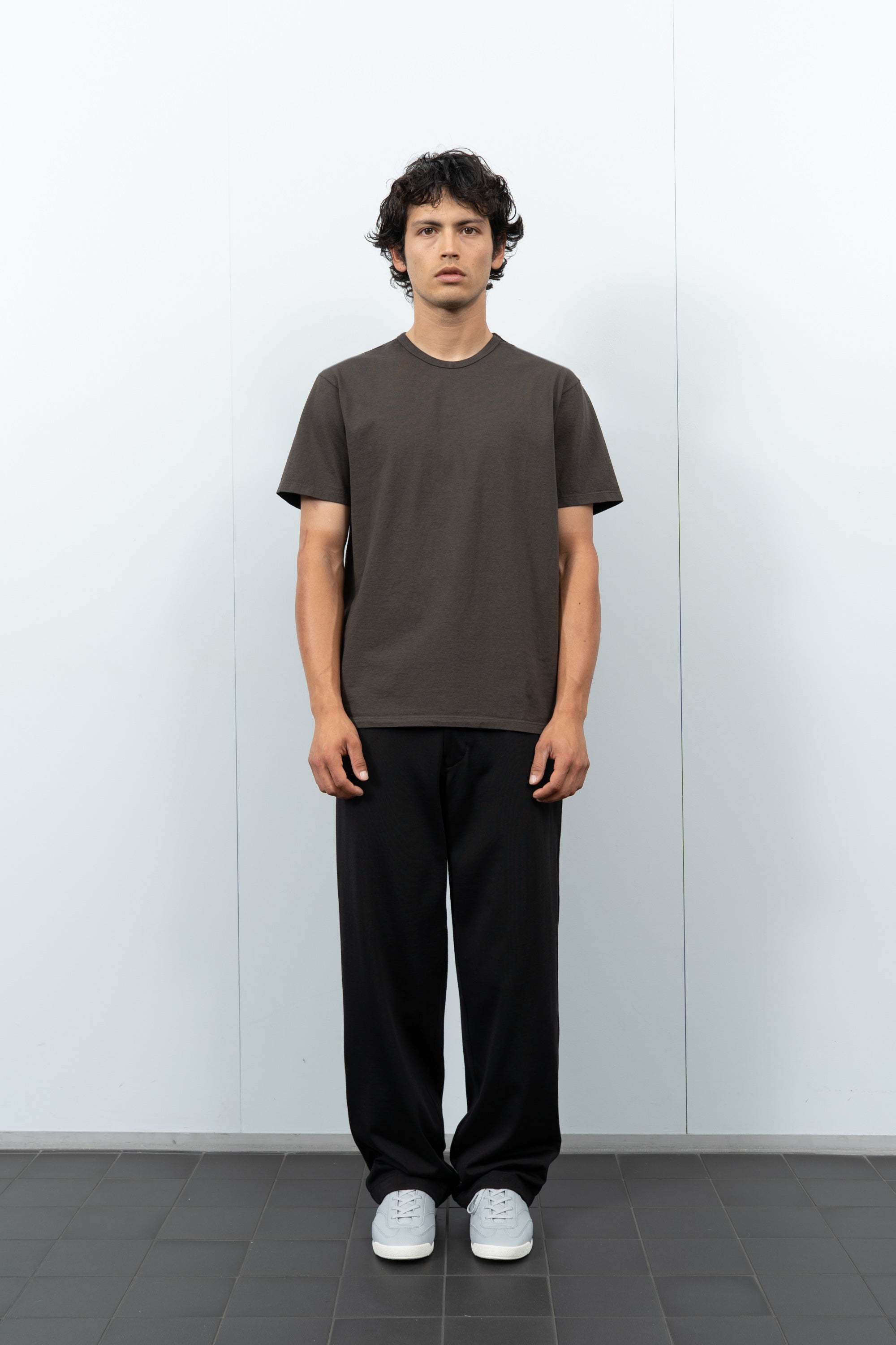 Front-facing on-model photograph of model wearing LW101 Our T-shirt in Black Pine