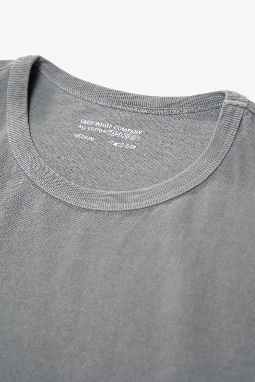 Close-up of collar of LW101 Our T-shirt in pigment kelp
