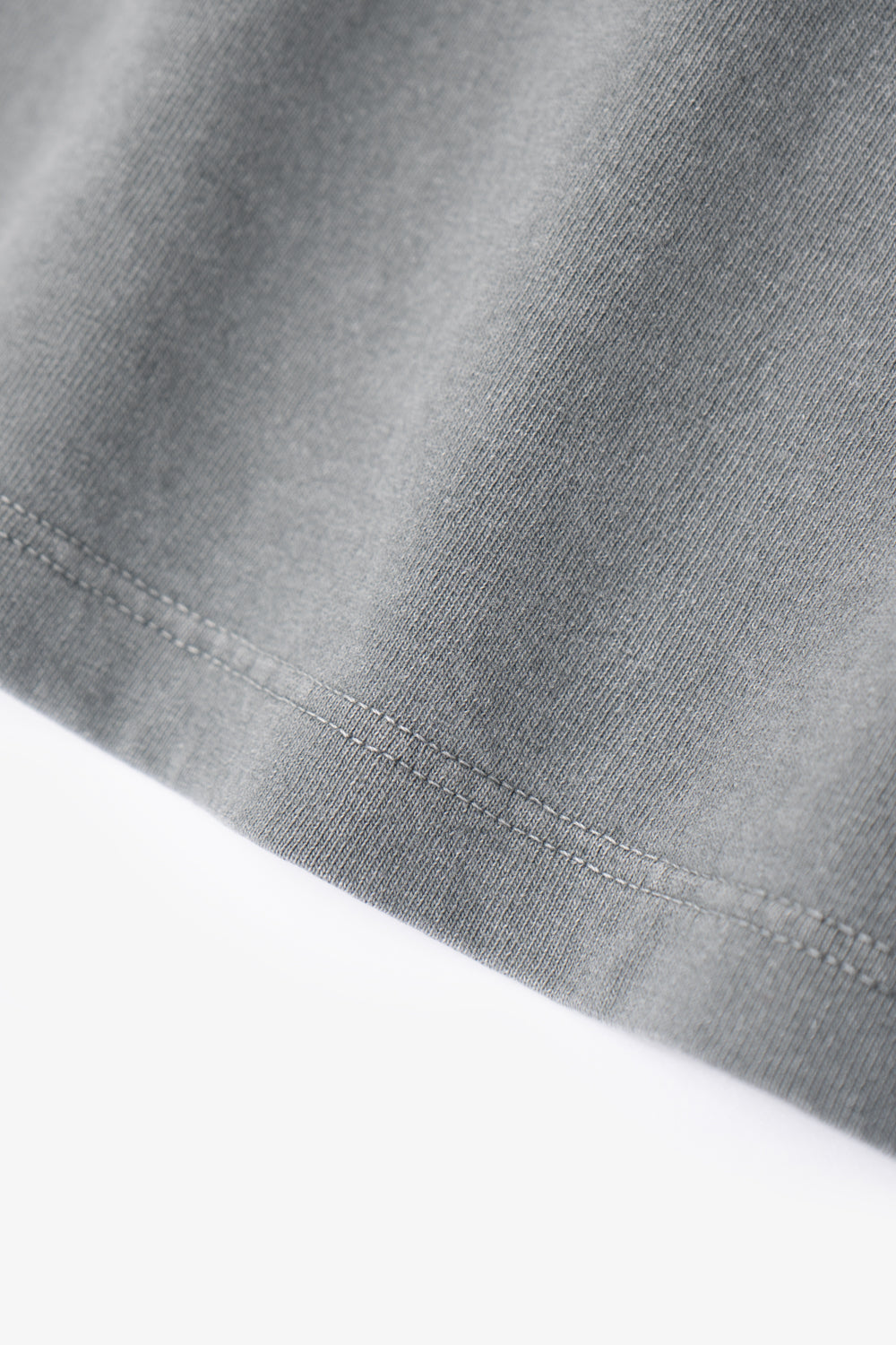 Close-up of fabric ripple of LW101 Our T-shirt in pigment kelp