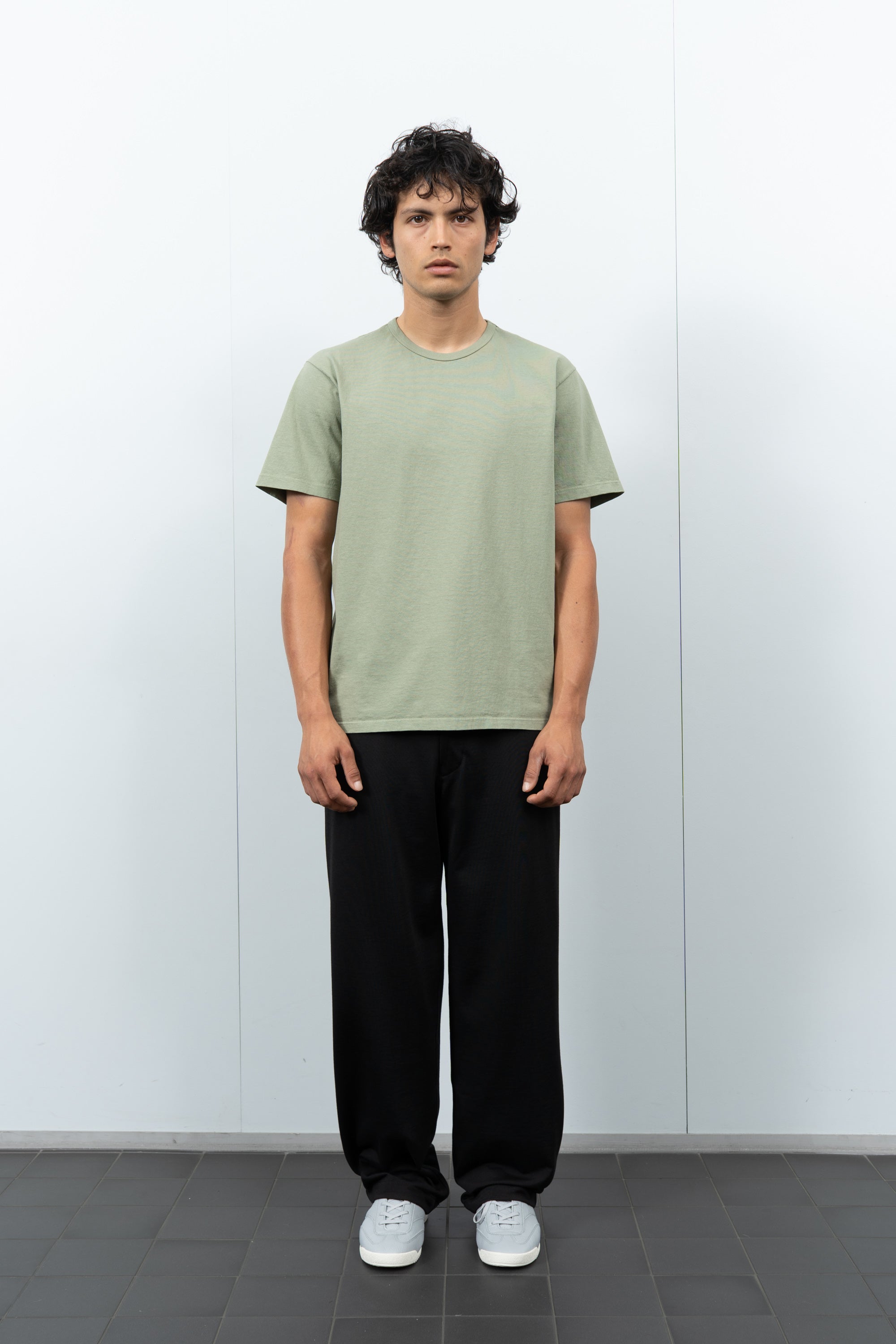 Front-facing on-model photograph of model wearing LW101 Our T-shirt in Pistachio