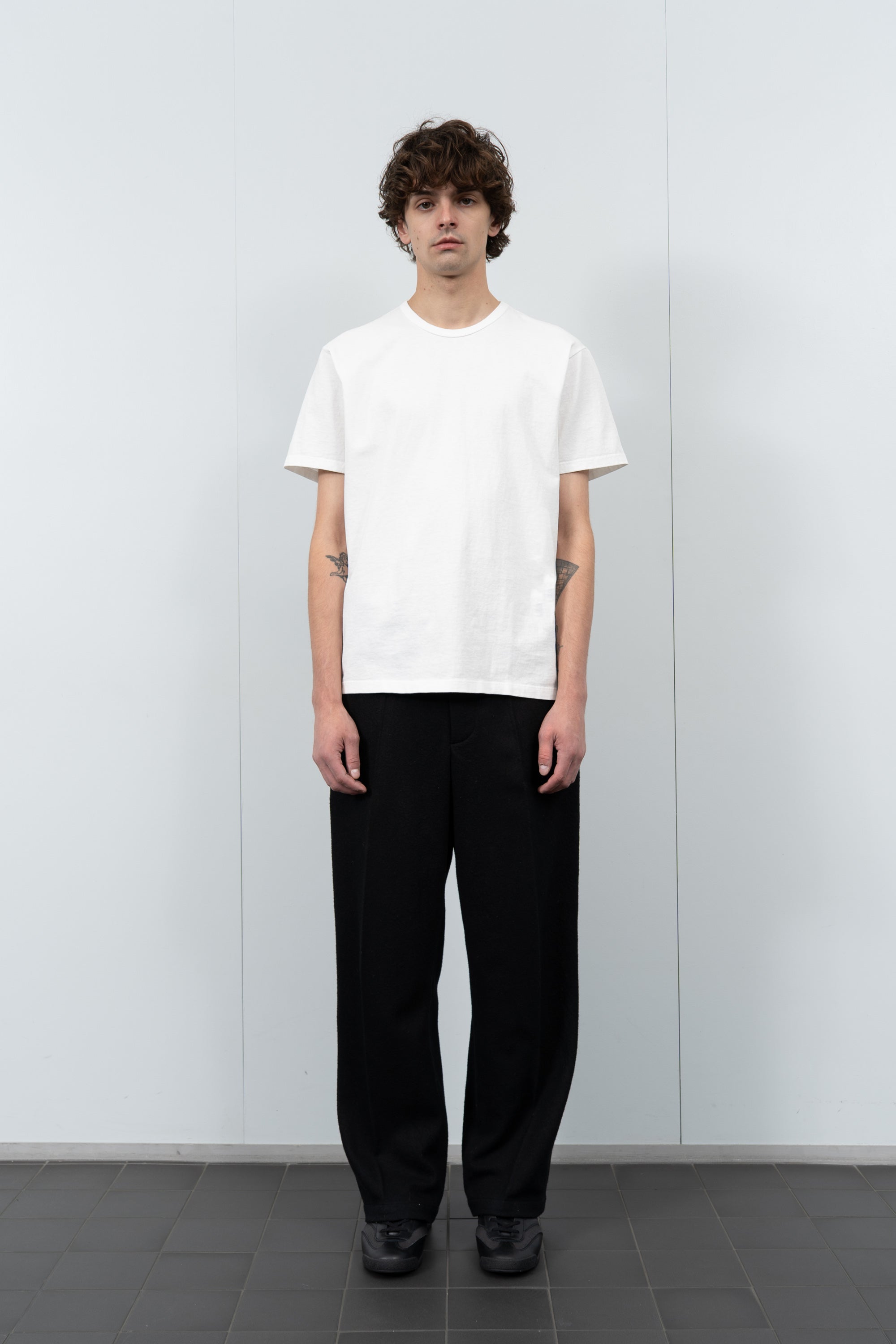 Model poses in LW101 Our T-shirt in white