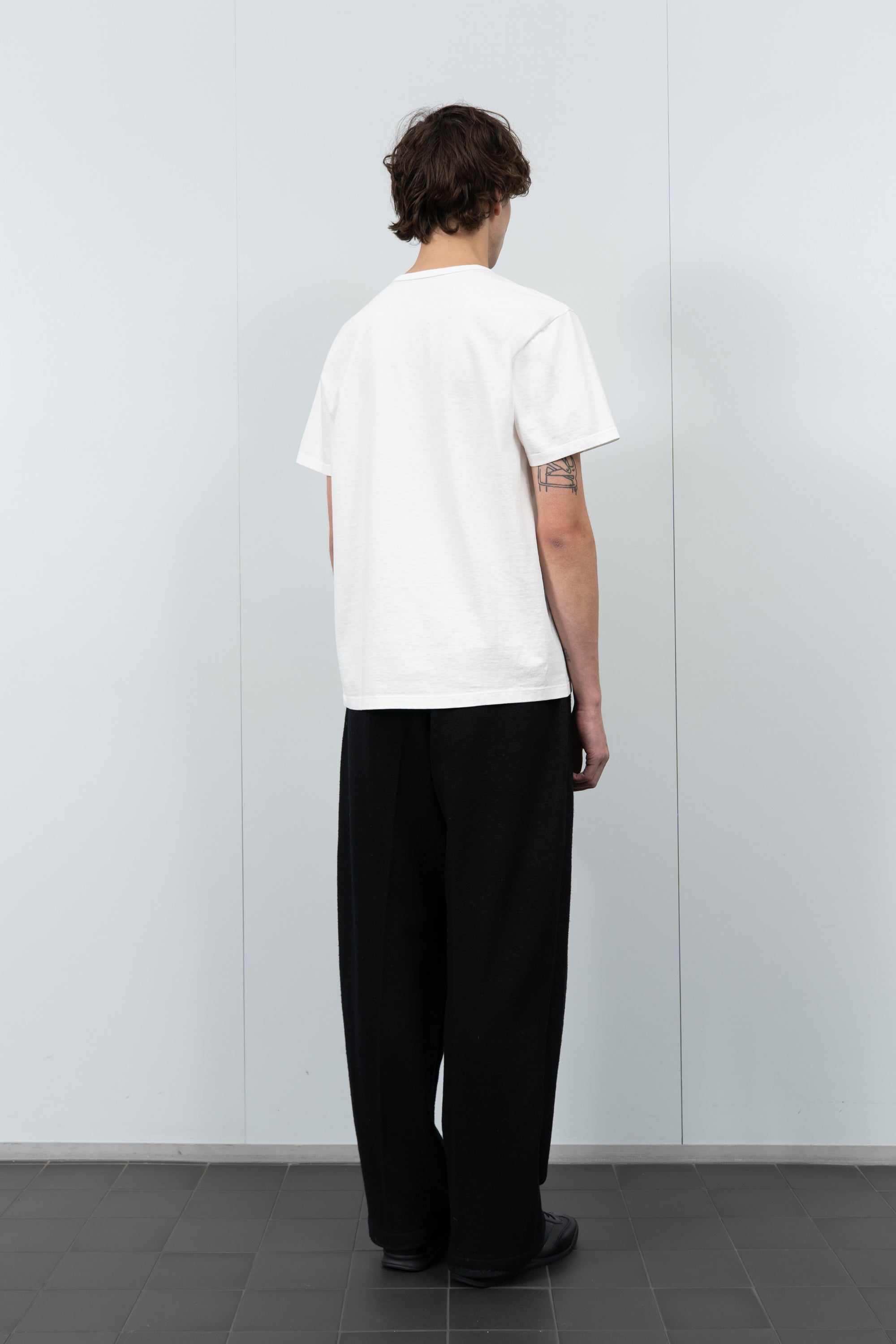 Model poses in LW101 Our T-shirt in white