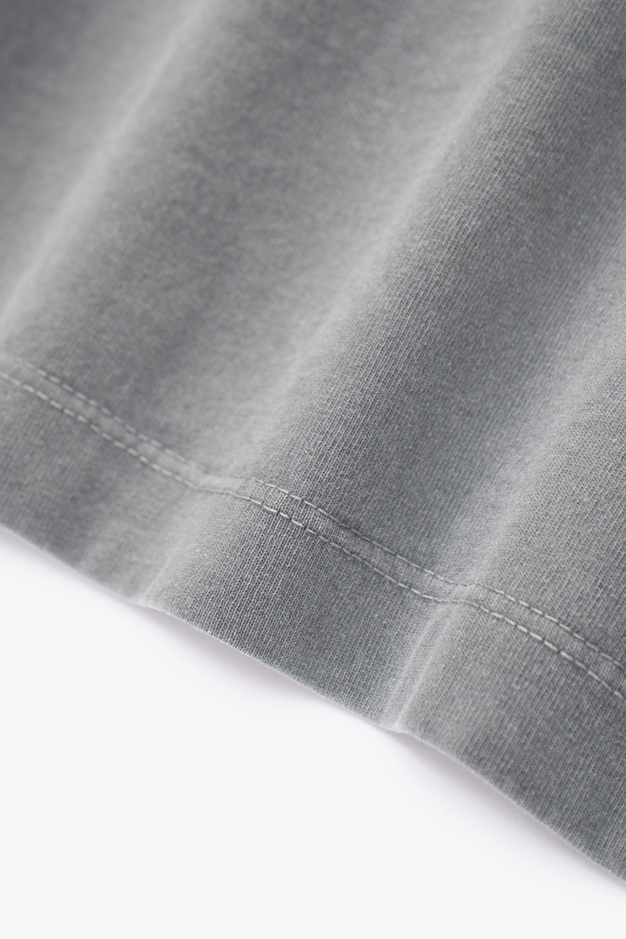 Close-up of fabric ripple of LW102 Municipal T-shirt in pigment kelp
