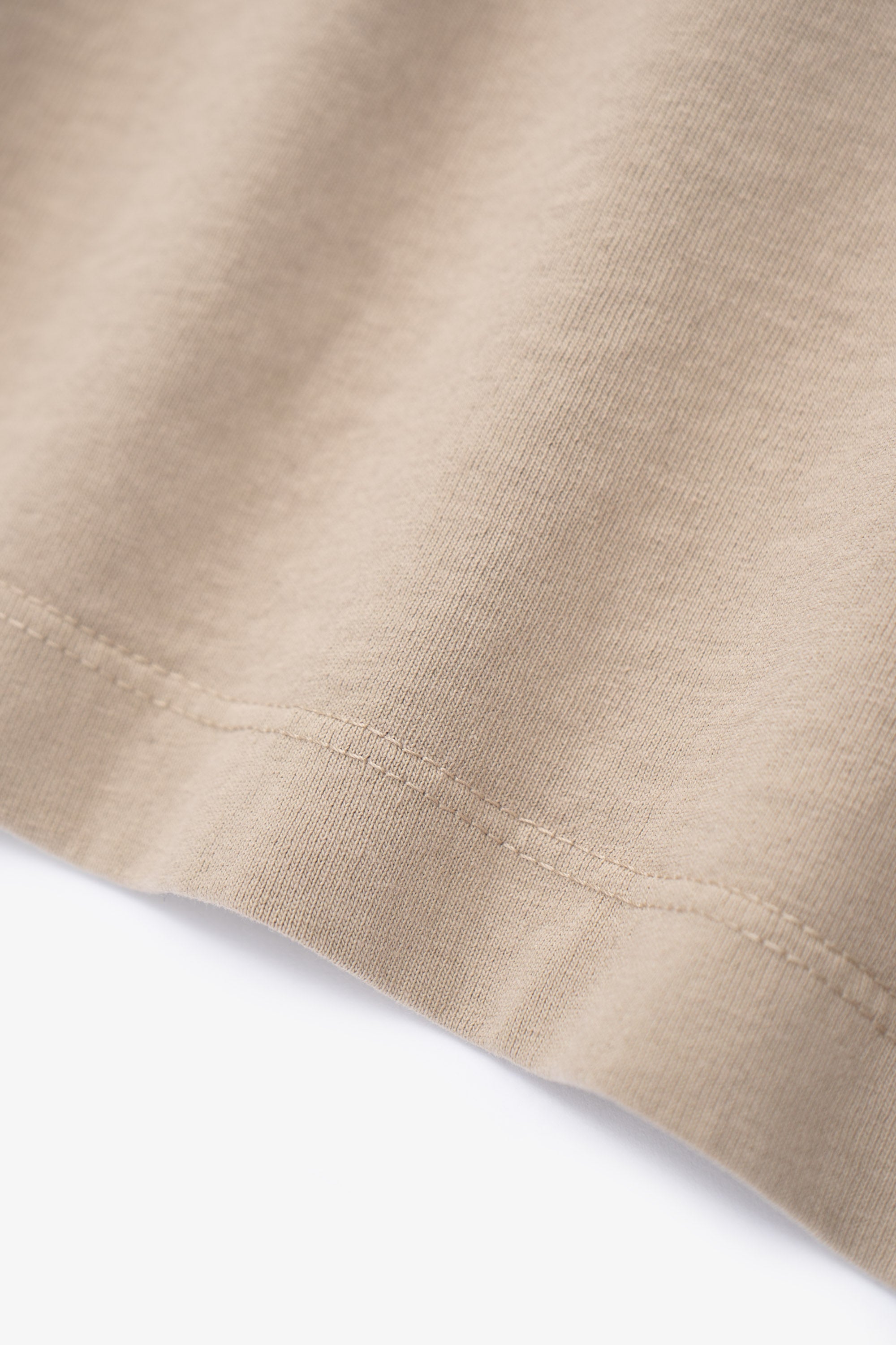 Close-up of fabric ripple of LW102 Municipal T-shirt in sand
