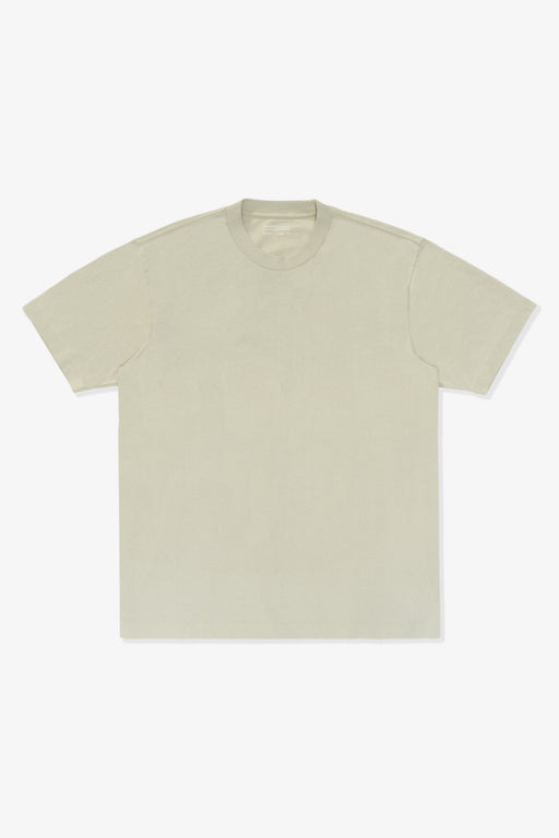 Full length flat-lay photograph of the LW102 Municipal T-shirt in a creamy green, “Swiss Natural”