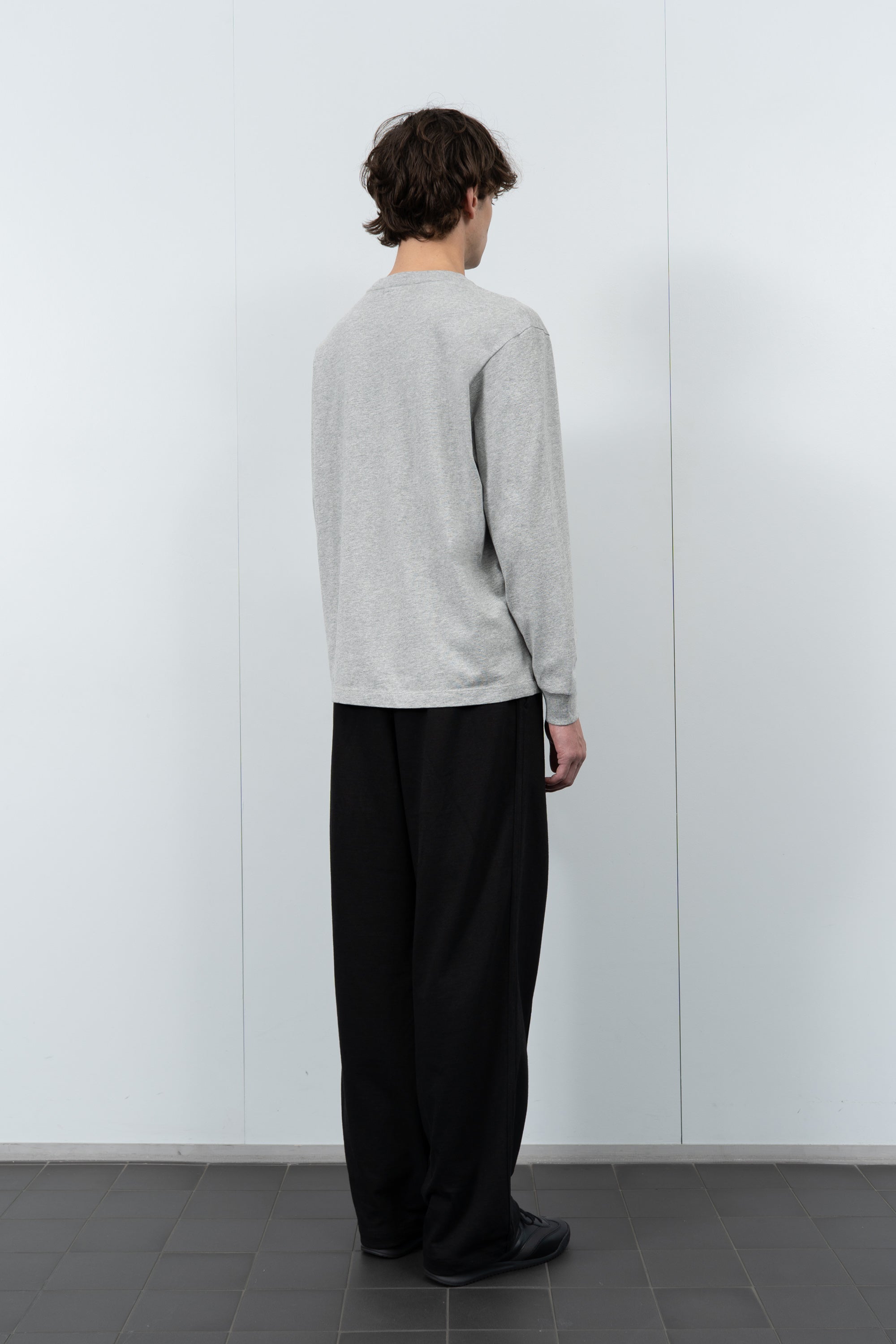 Model poses in LW102LS LS Municipal Pocket T-shirt in heather grey